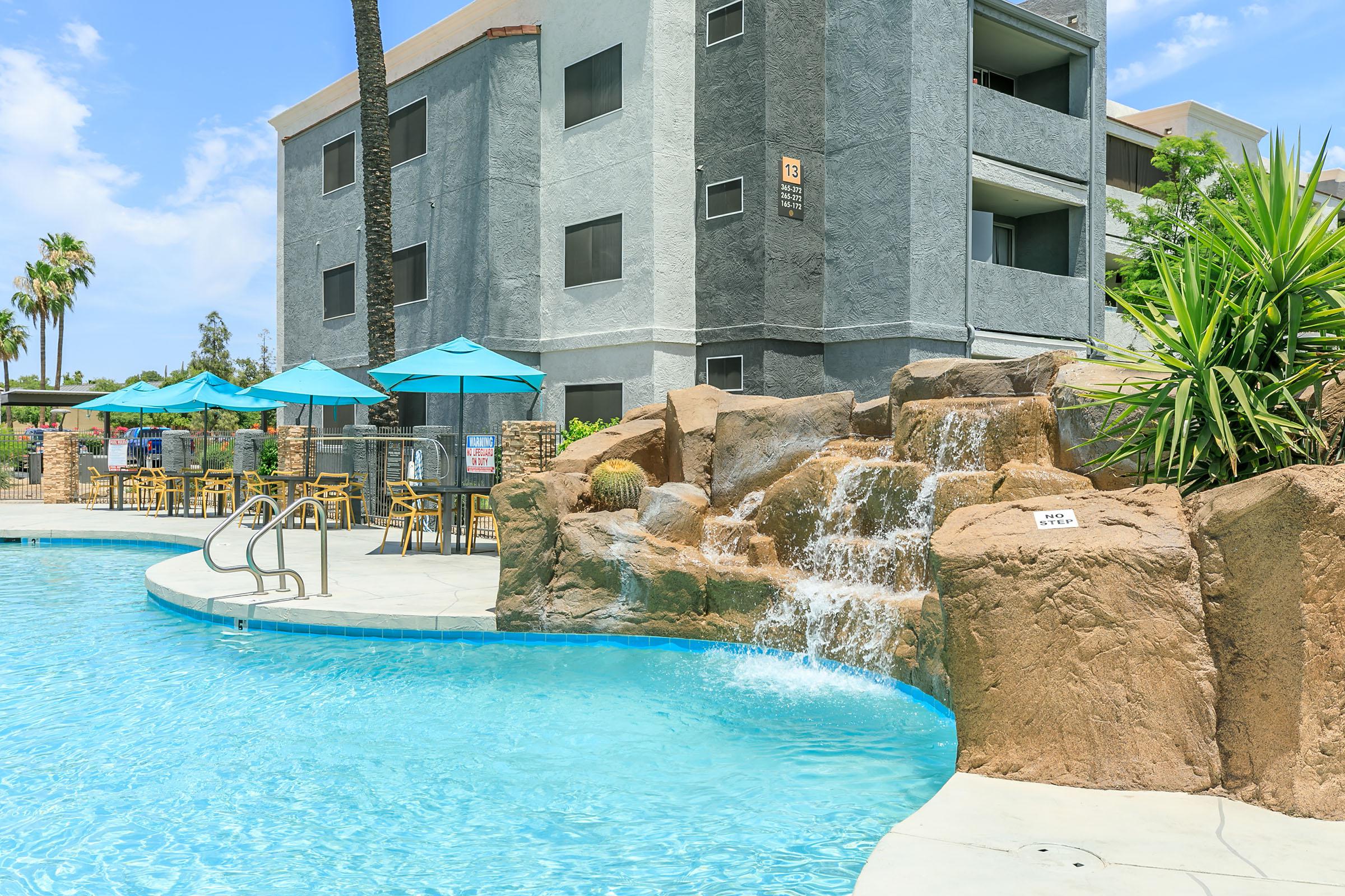 a large pool of water in front of a building