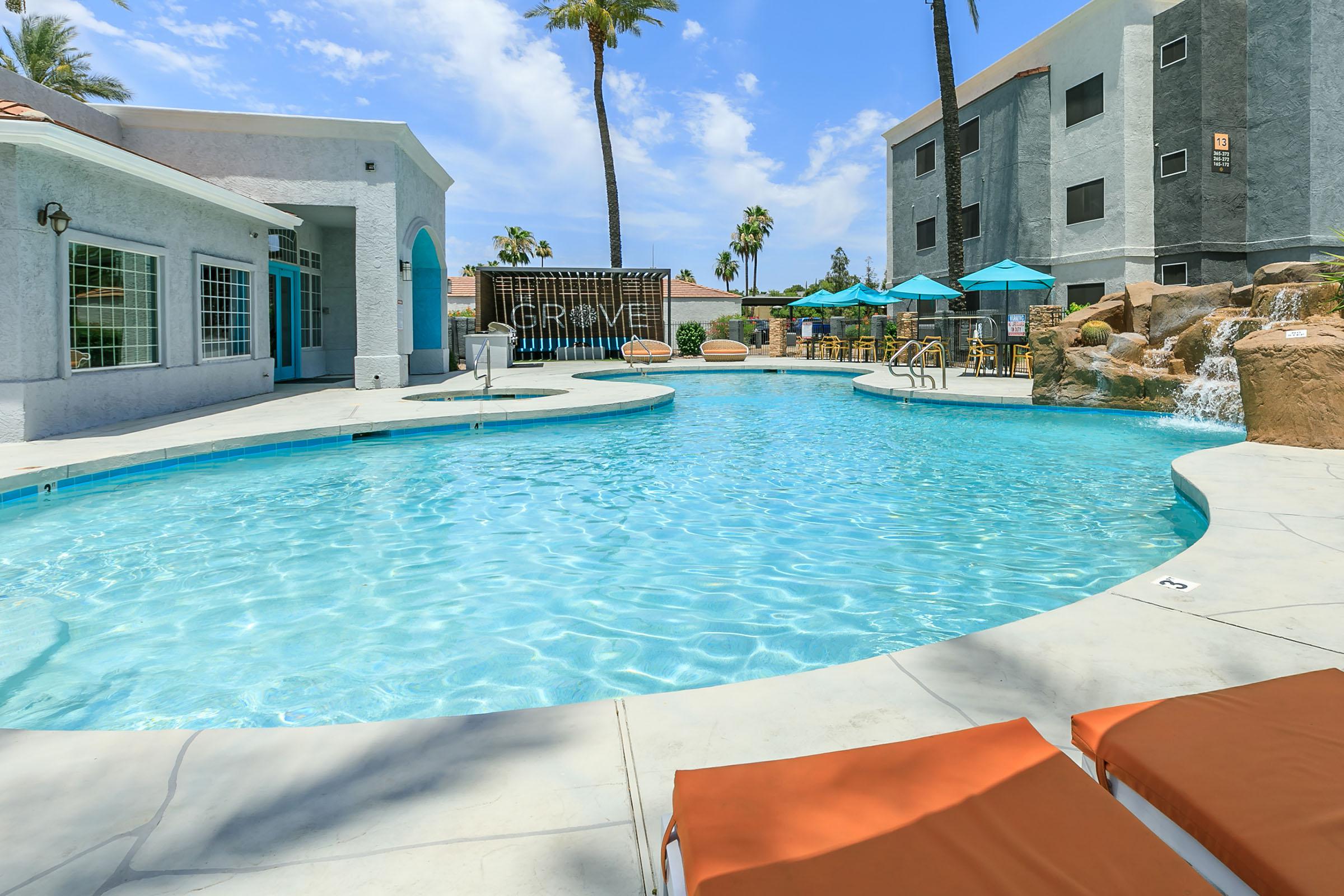 a large pool of water in front of a house