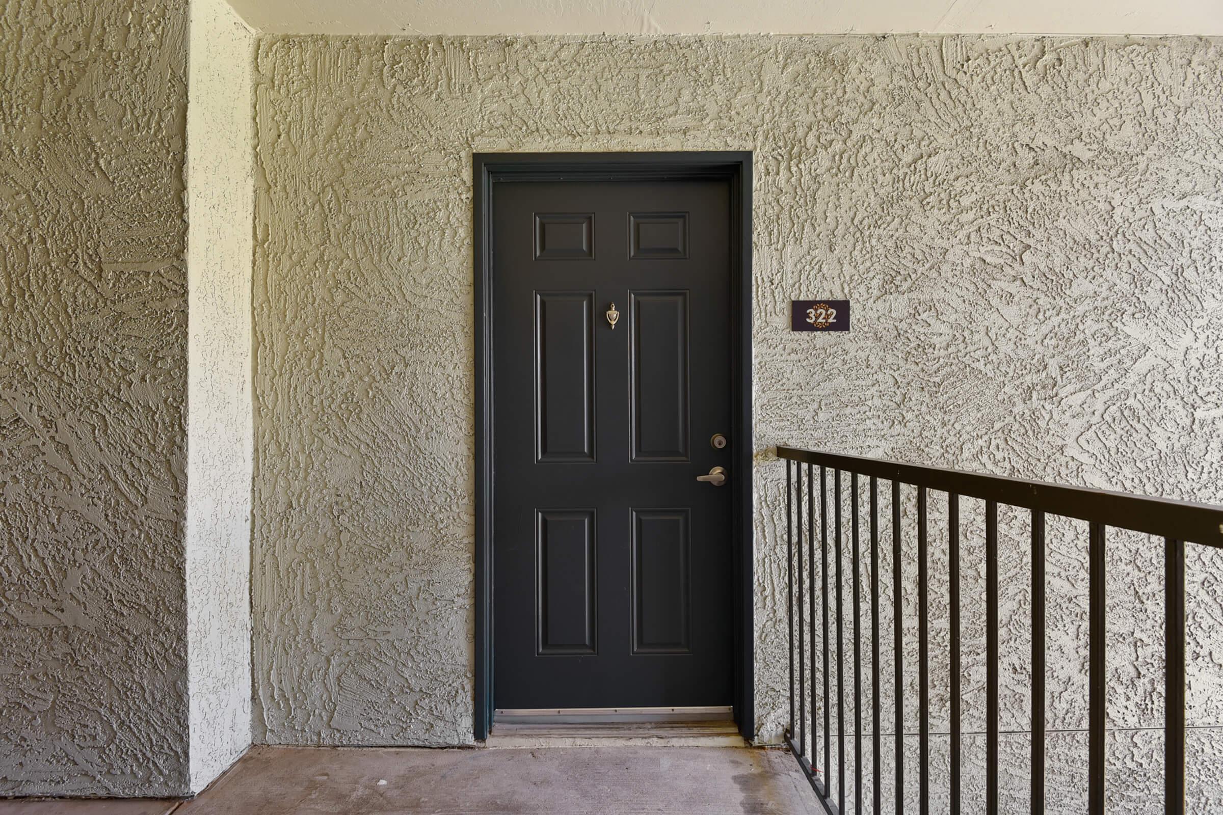 a bench in front of a door