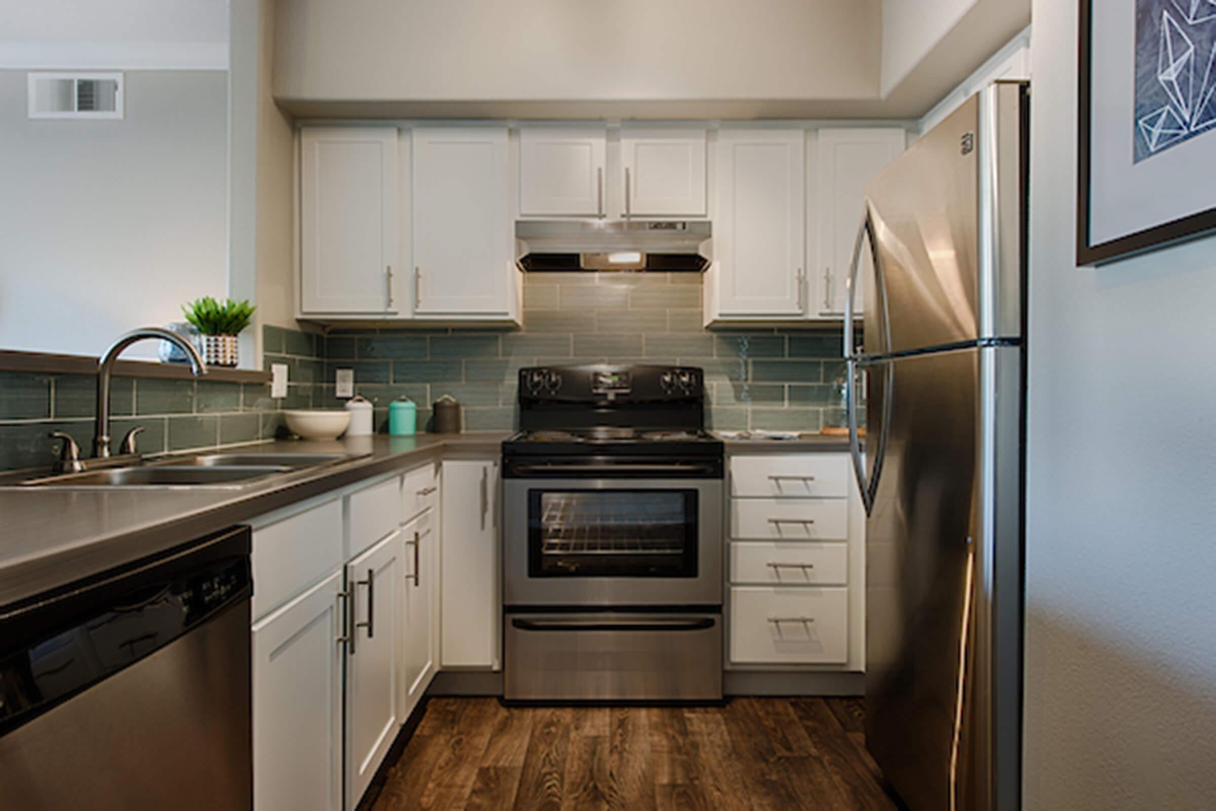 a modern kitchen with stainless steel appliances