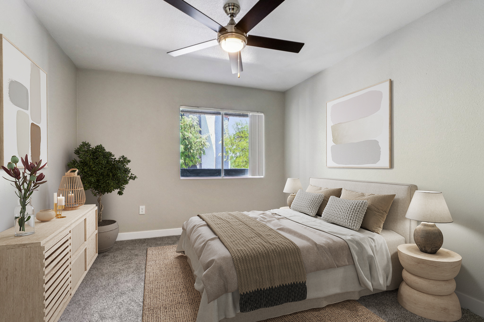 A cozy bedroom featuring a queen-sized bed with neutral bedding, two bedside lamps, and decorative pillows. There is a wooden dresser, a plant in the corner, and artwork on the walls. A window lets in natural light, illuminating the soft, warm tones of the room.