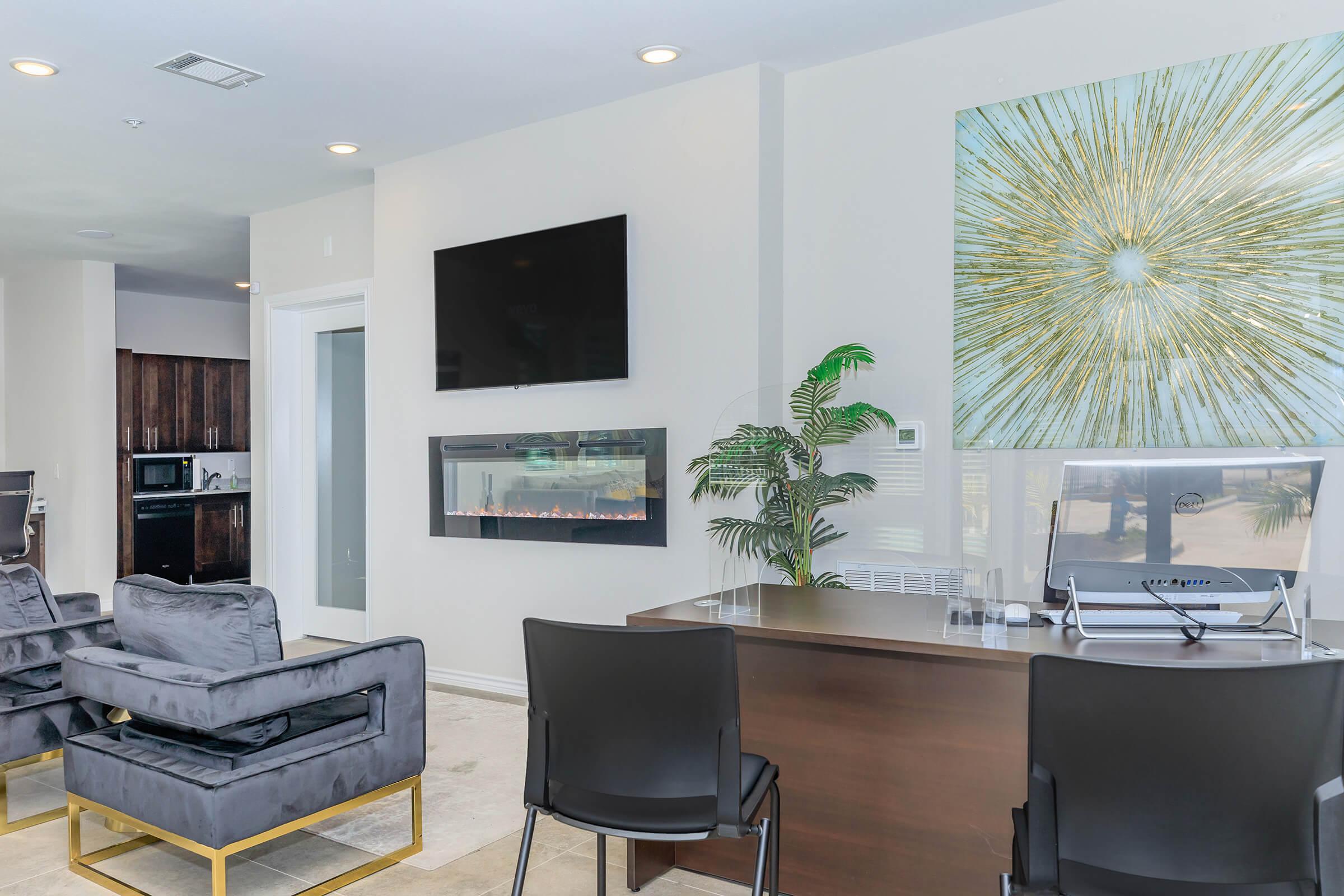 a living room filled with furniture and a large window