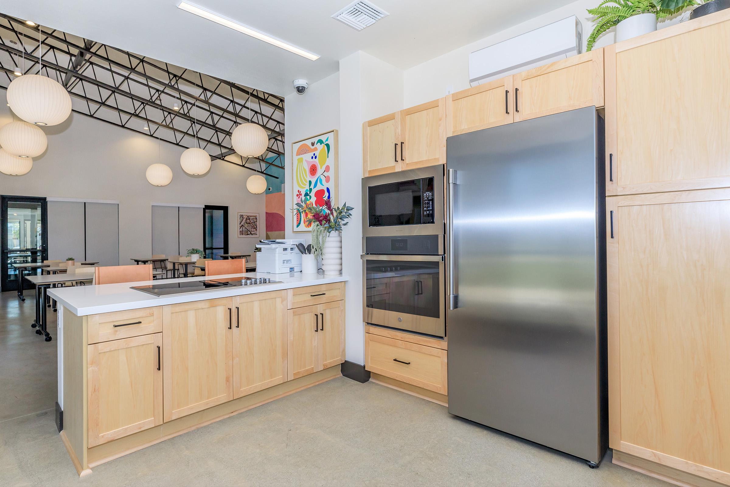 a stainless steel refrigerator in a kitchen