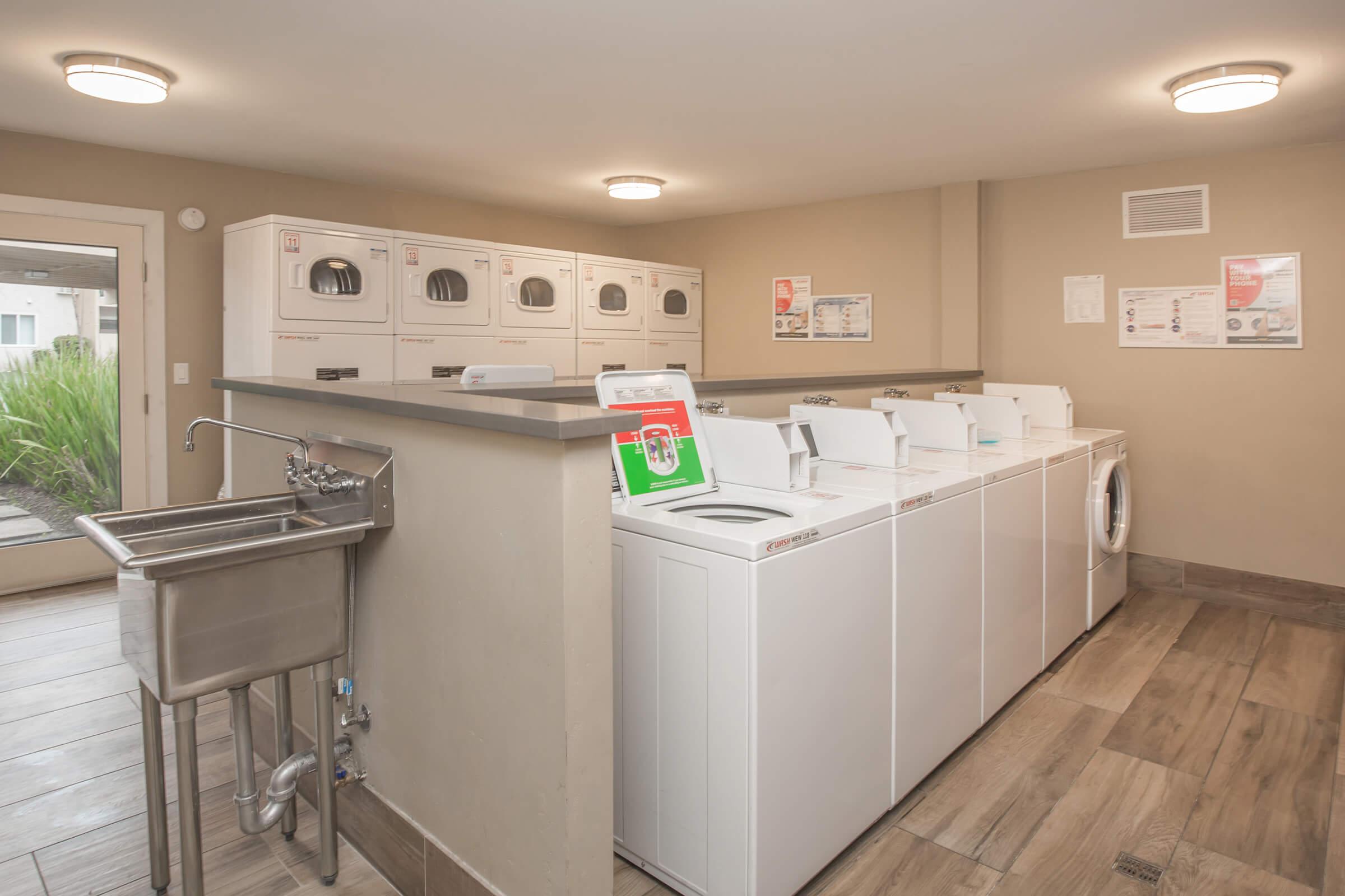 a kitchen with a sink and a refrigerator