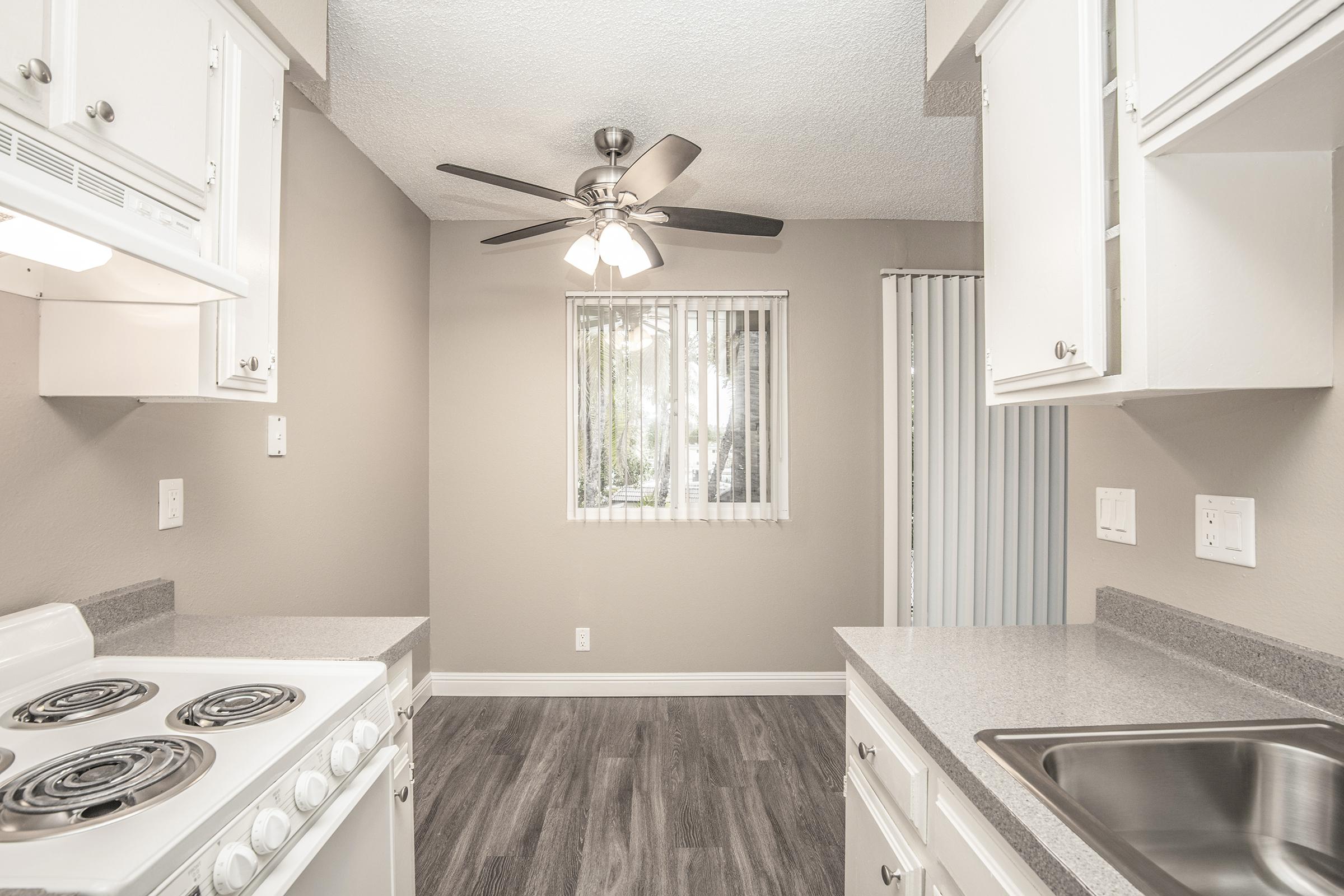 a kitchen with a stove and a sink