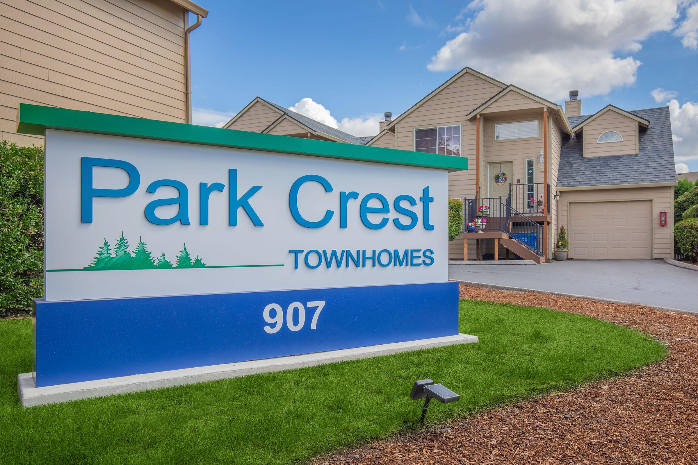 a sign in front of a house