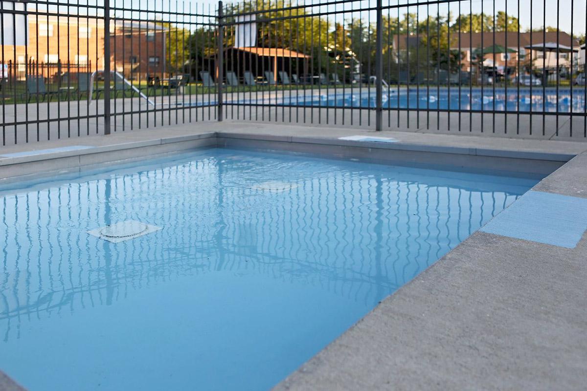 a pool next to a fence