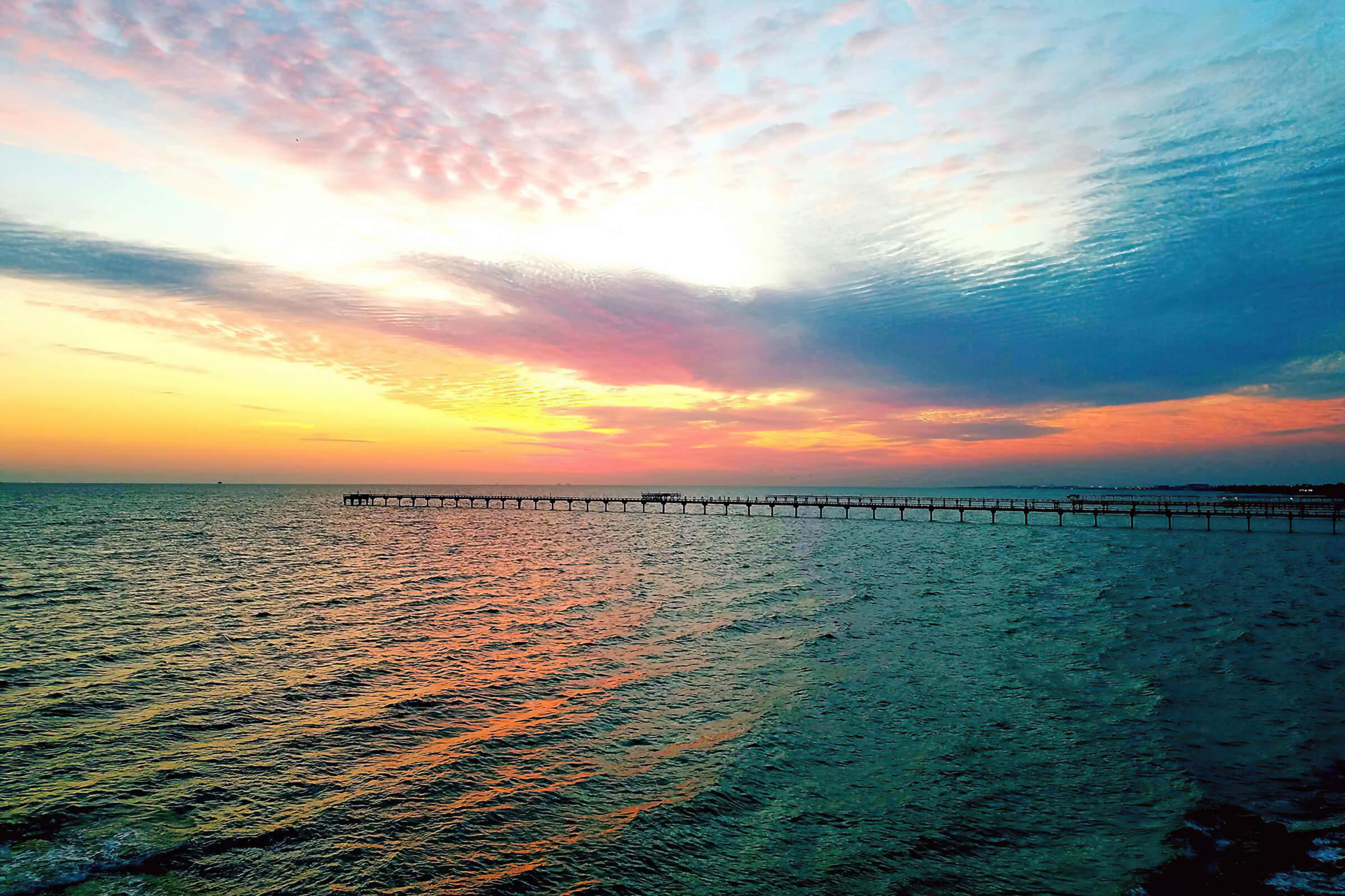 a sunset over a body of water