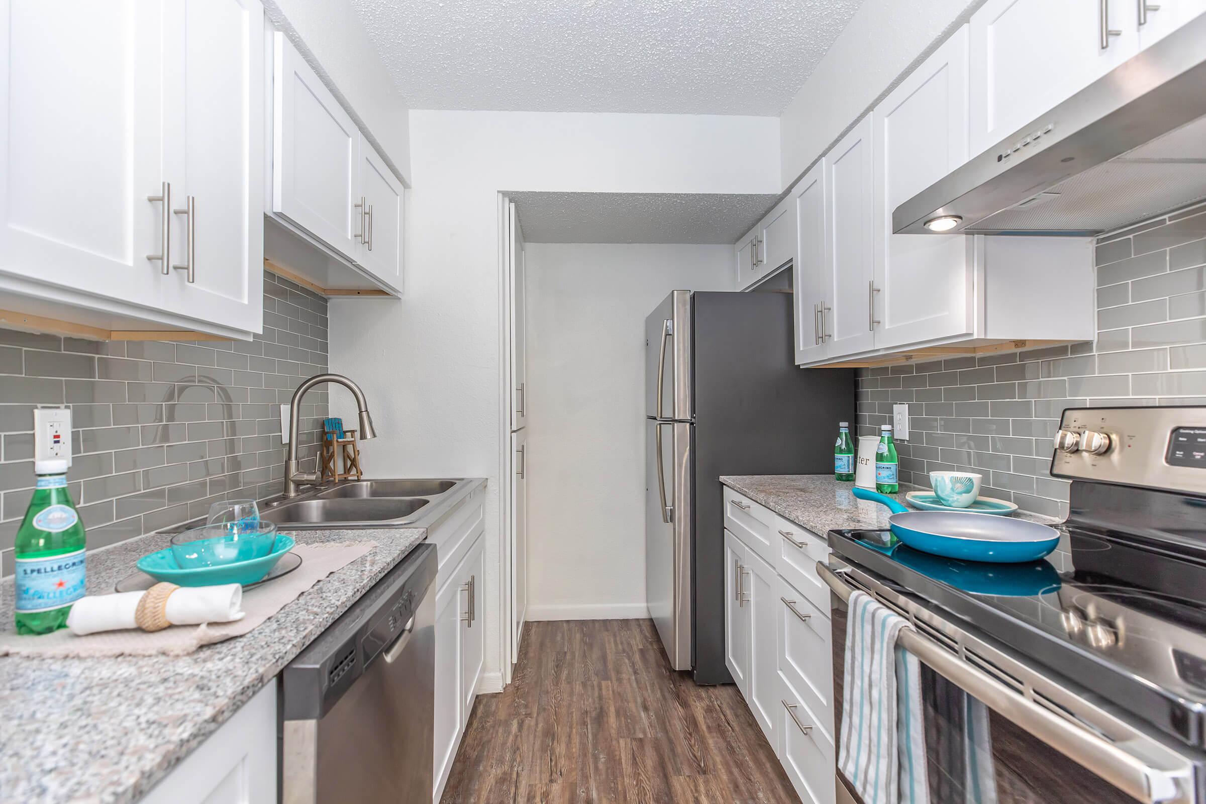 a kitchen with a stove and a sink