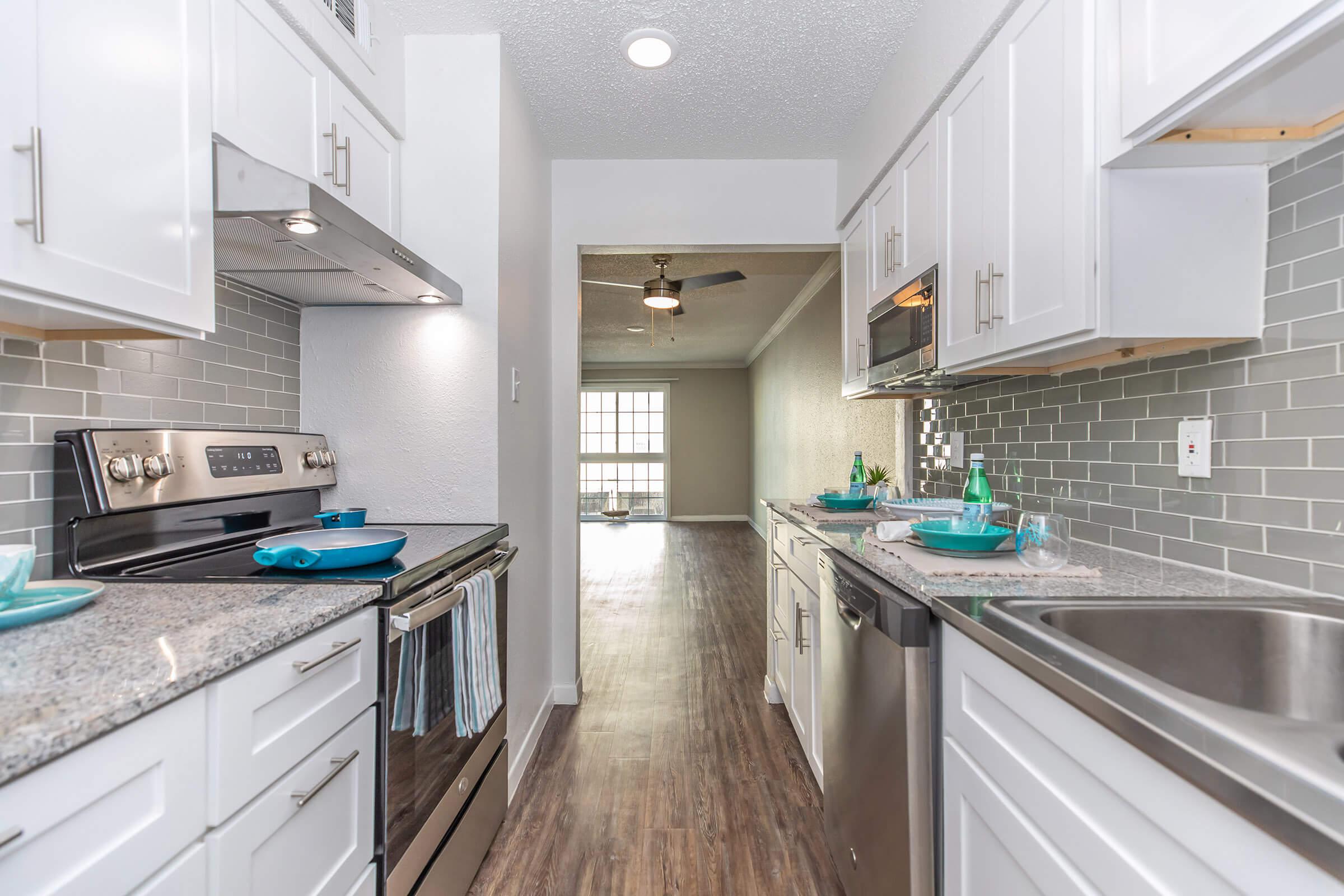 FULLY-EQUIPPED KITCHENS AT THE ARTS APARTMENTS AT OCEAN DRIVE