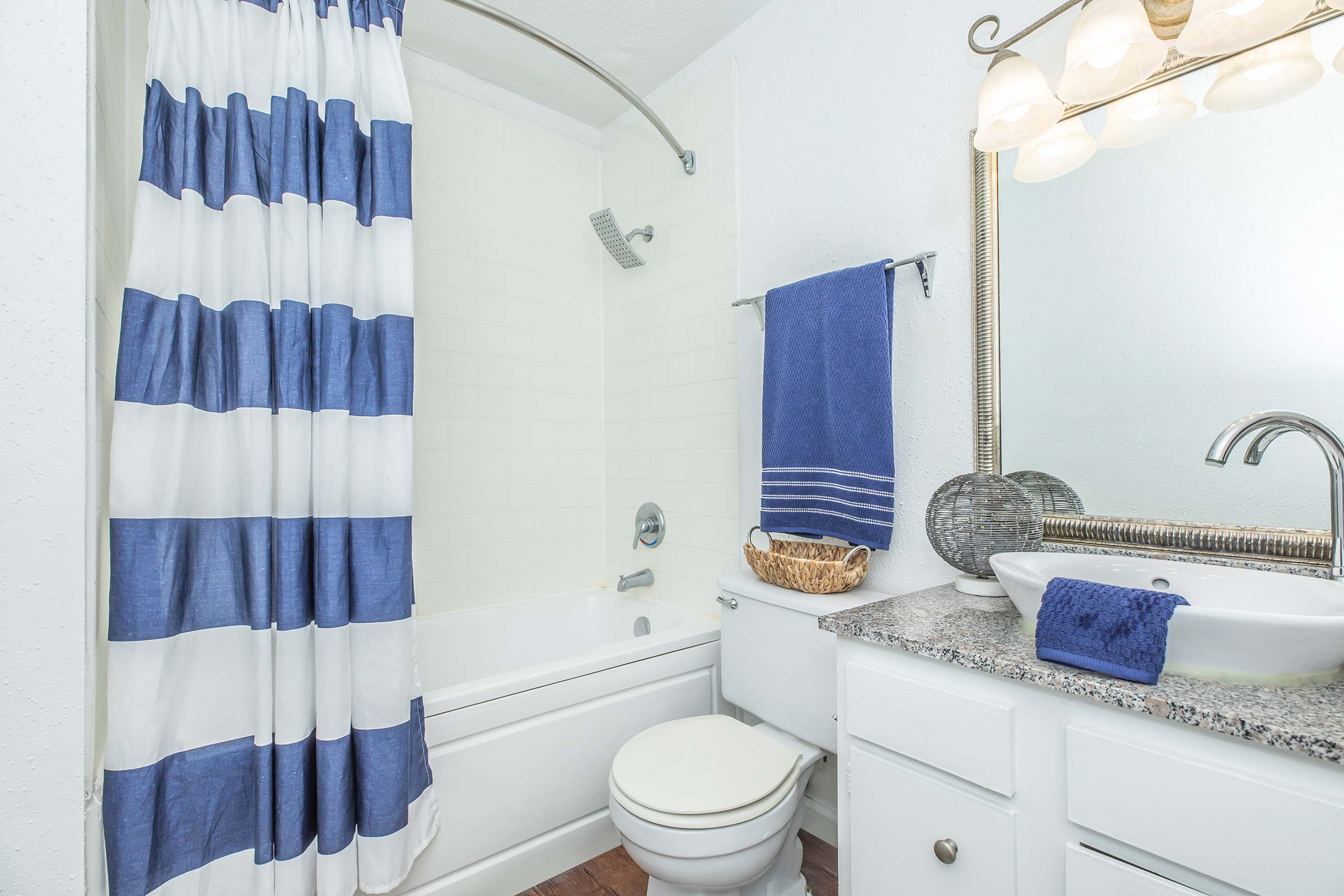 a shower curtain next to a sink