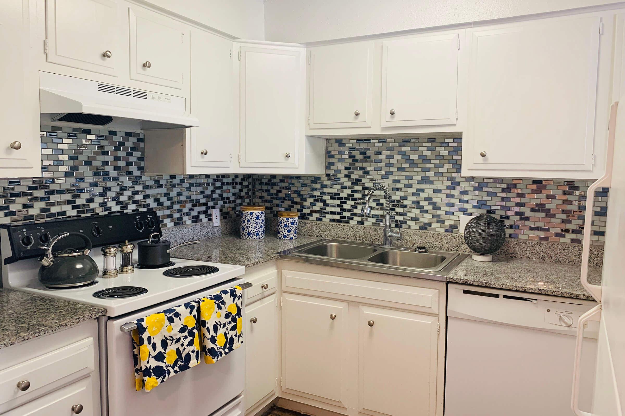 a kitchen with a stove top oven