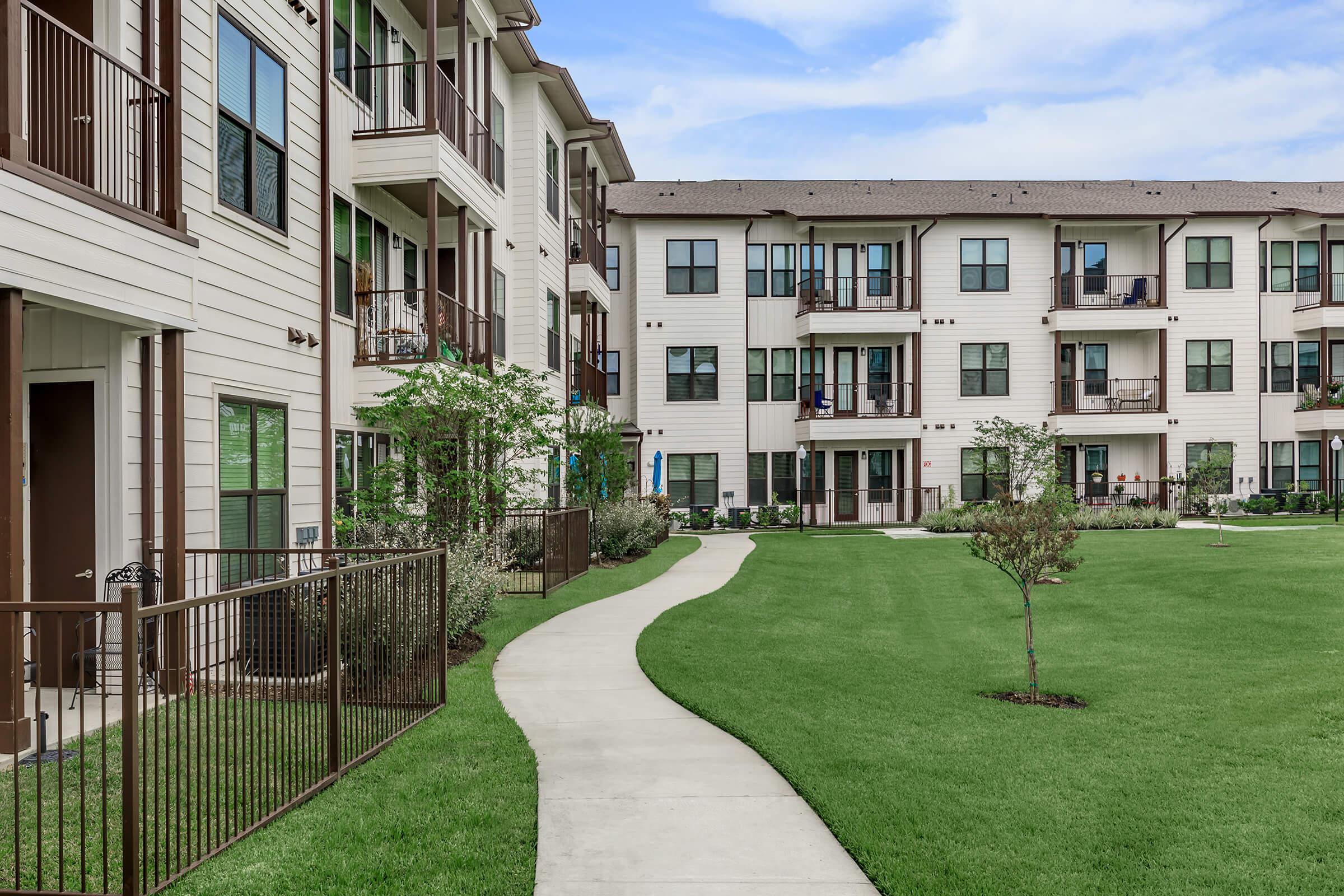 a large lawn in front of a building