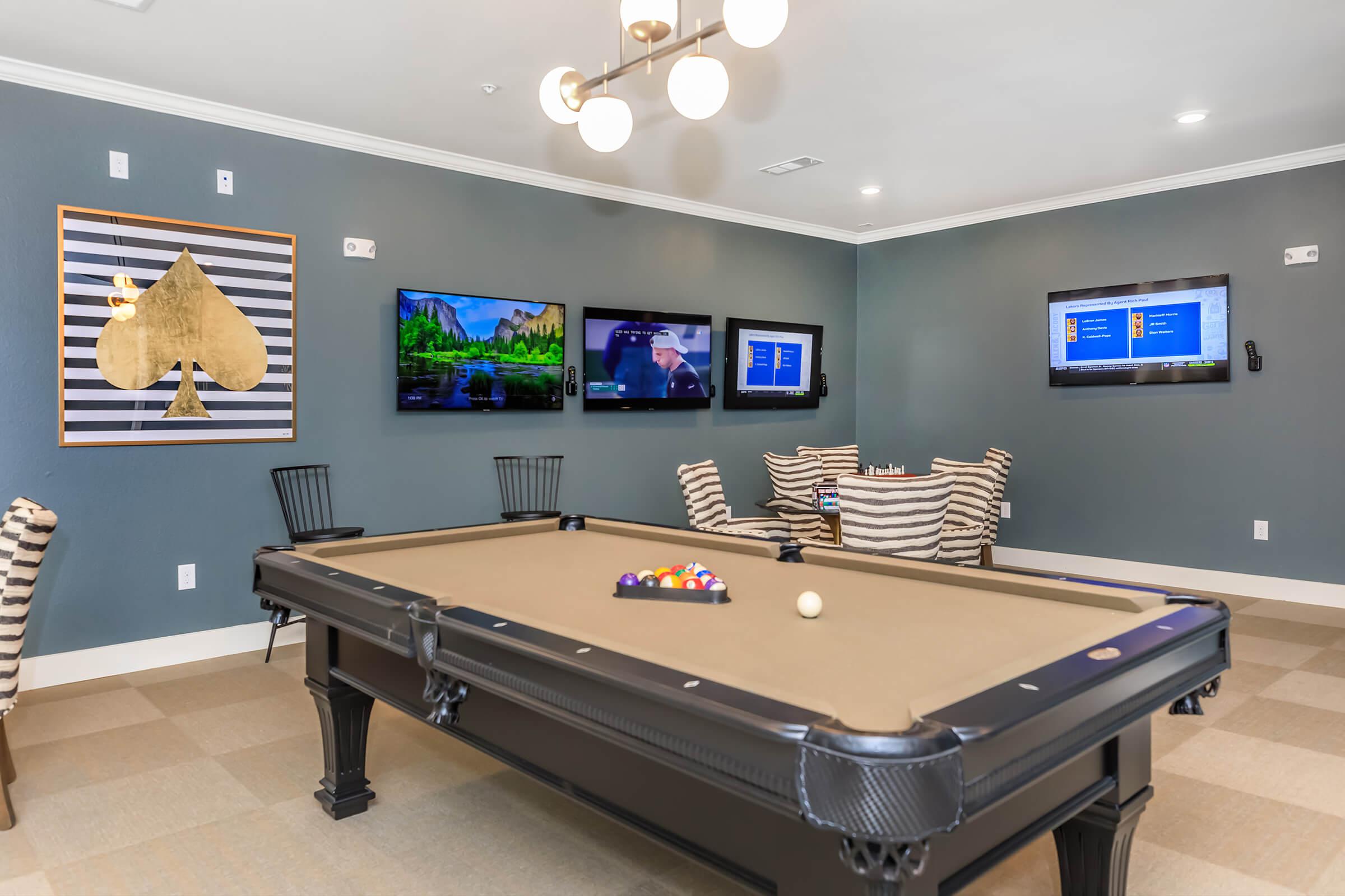 a flat screen tv sitting on top of a table