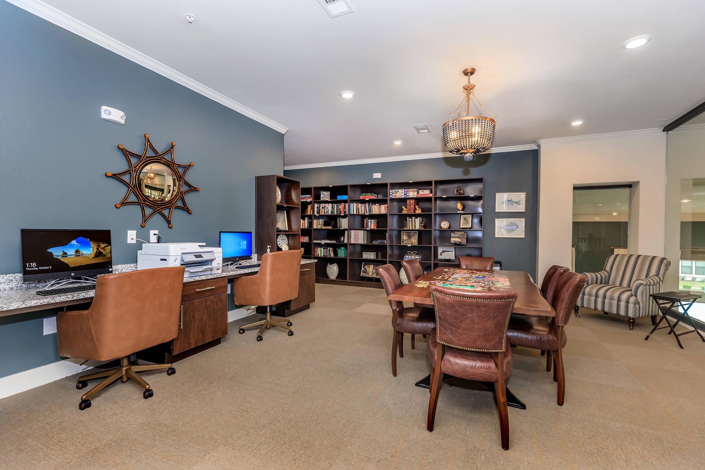 a living room filled with furniture and a flat screen tv