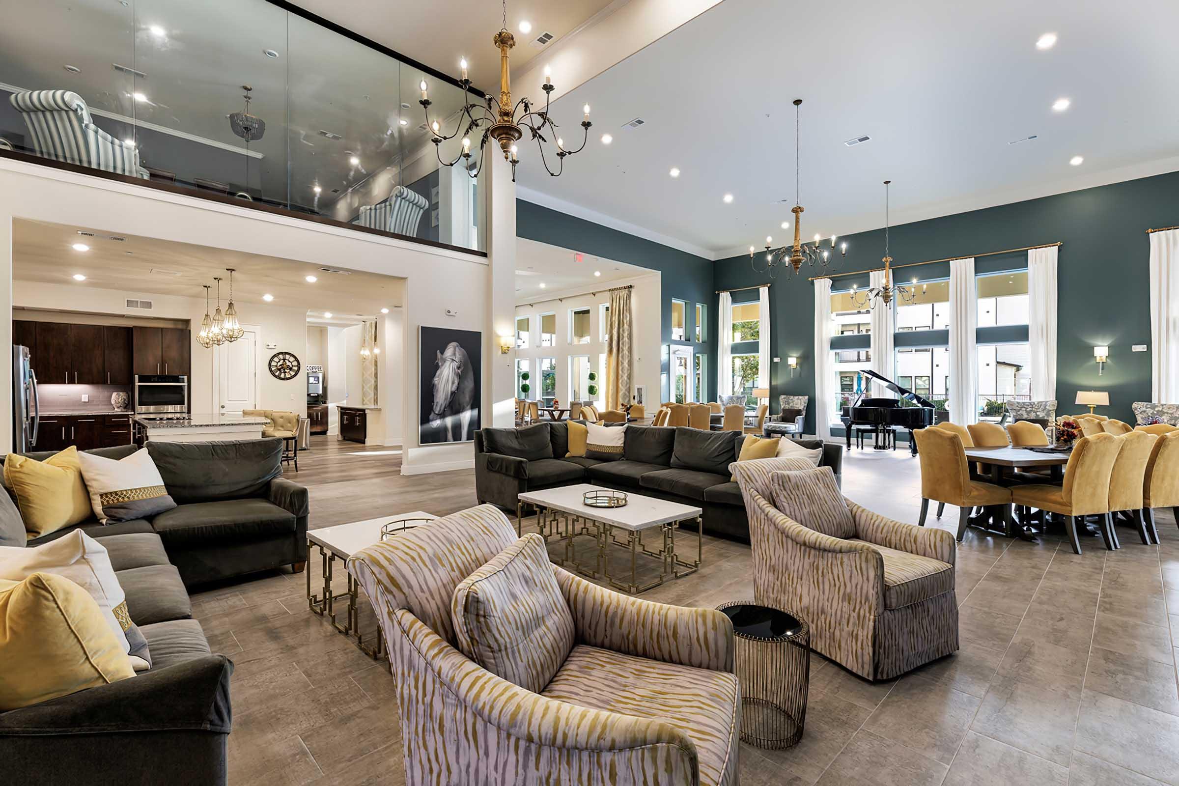 a living room filled with furniture and a large window