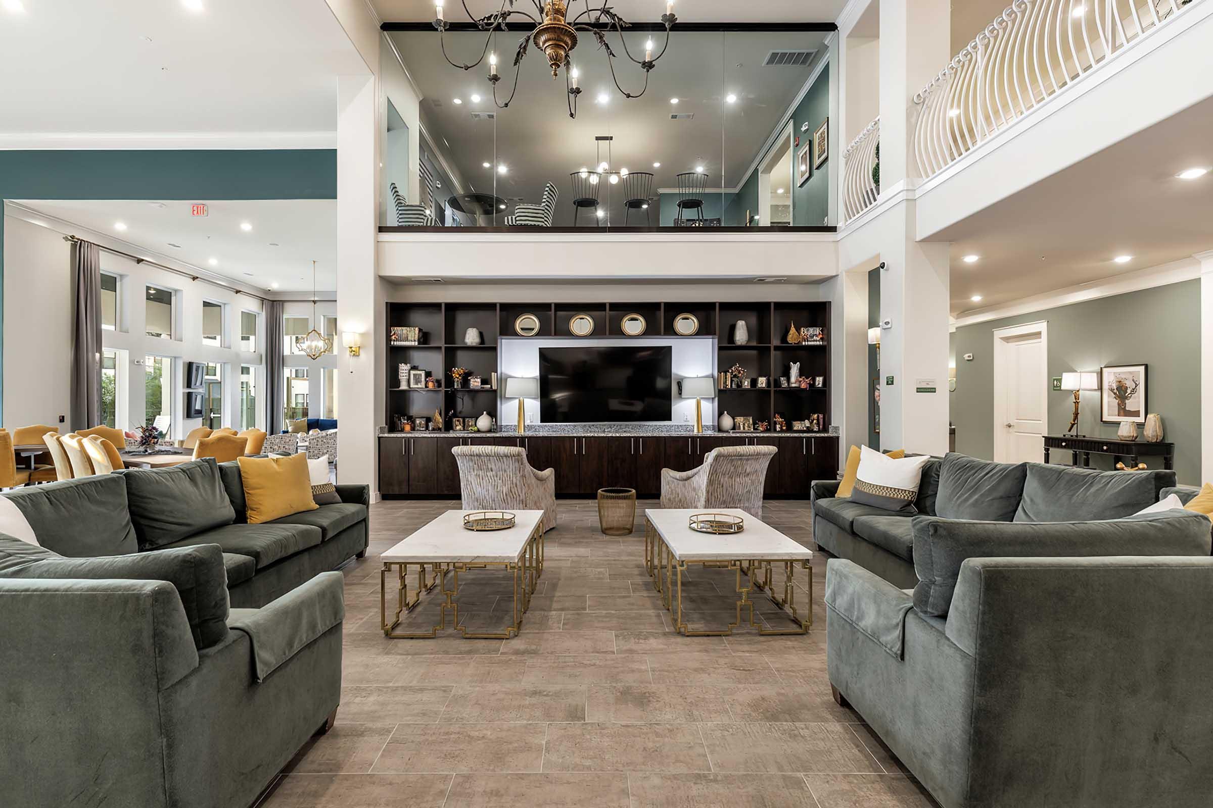 a living room filled with furniture and a fireplace