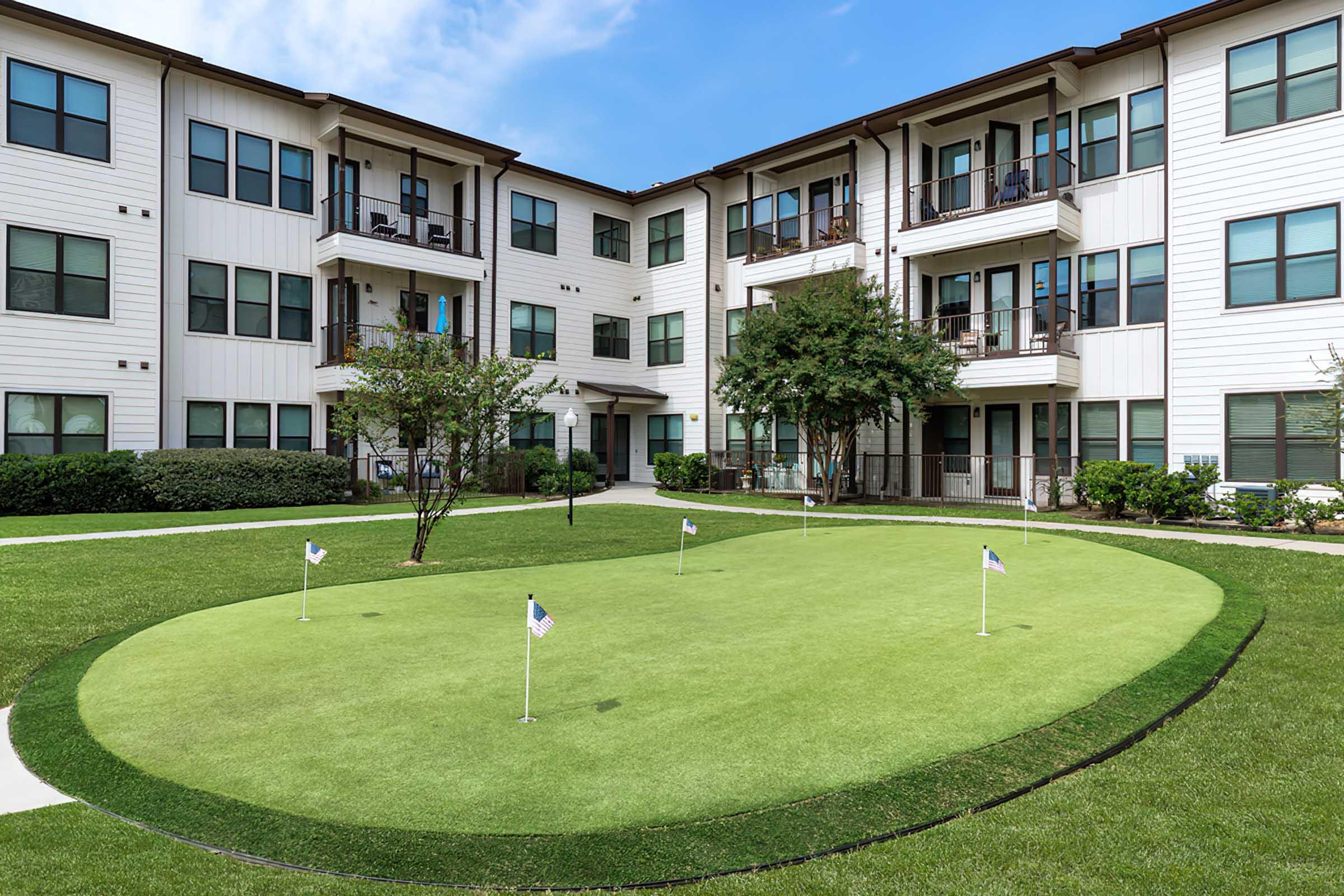 a large lawn in front of a building