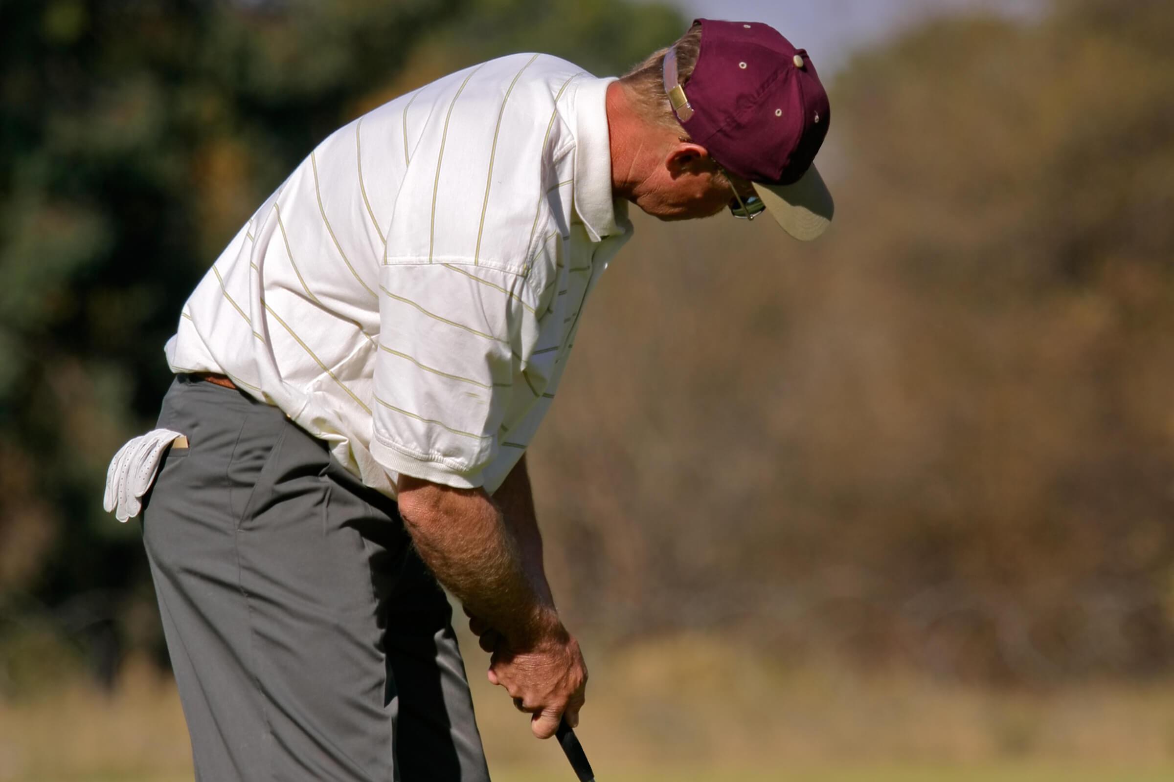 a man wearing a golf ball