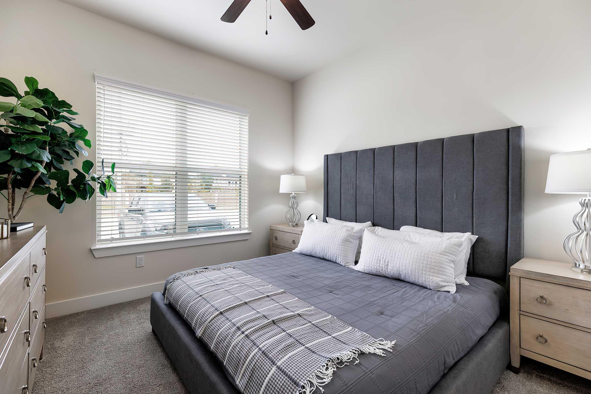 a bedroom with a large bed in a room