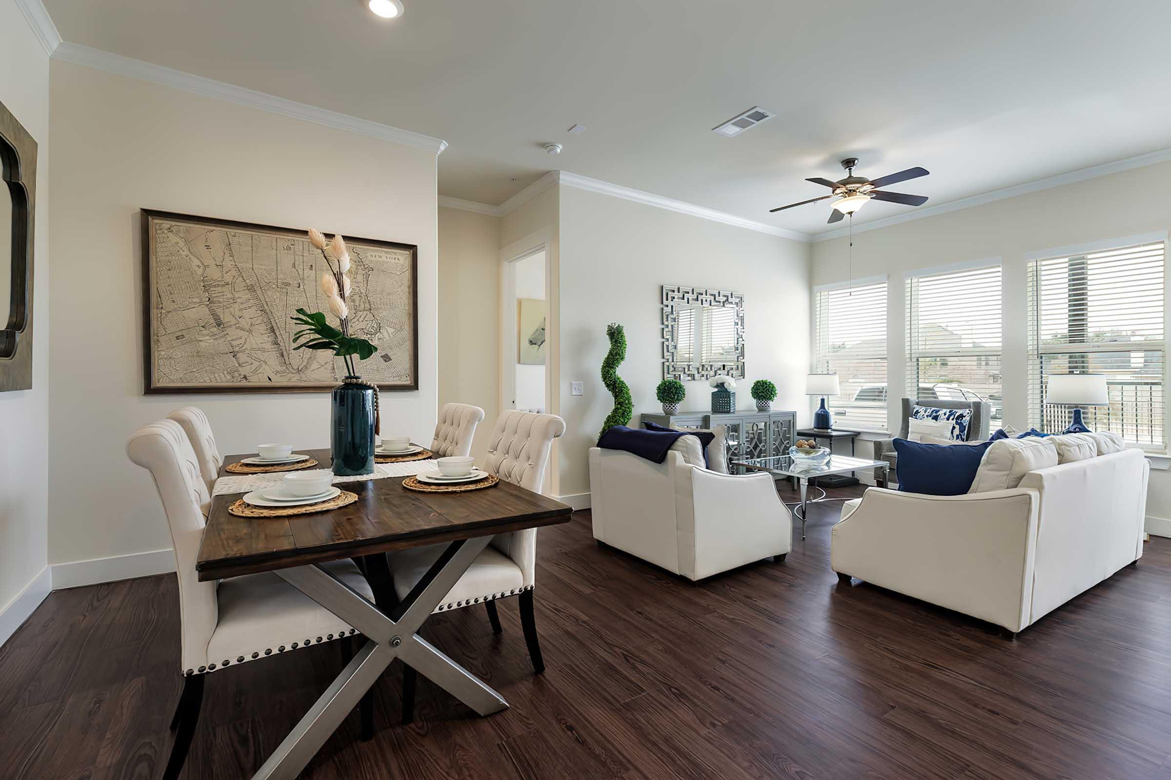 a living room filled with furniture and a large window