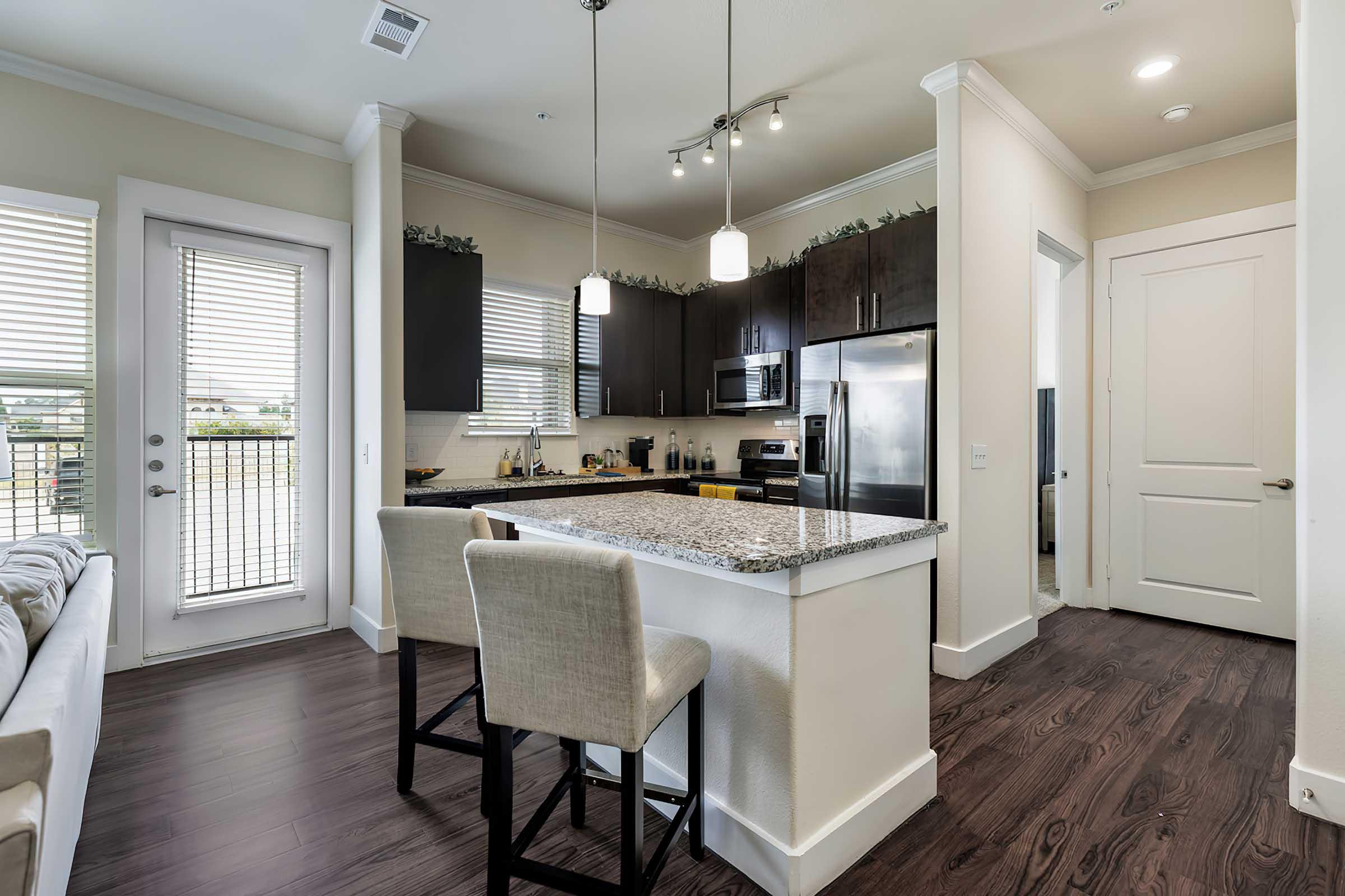 a room filled with furniture and a large window