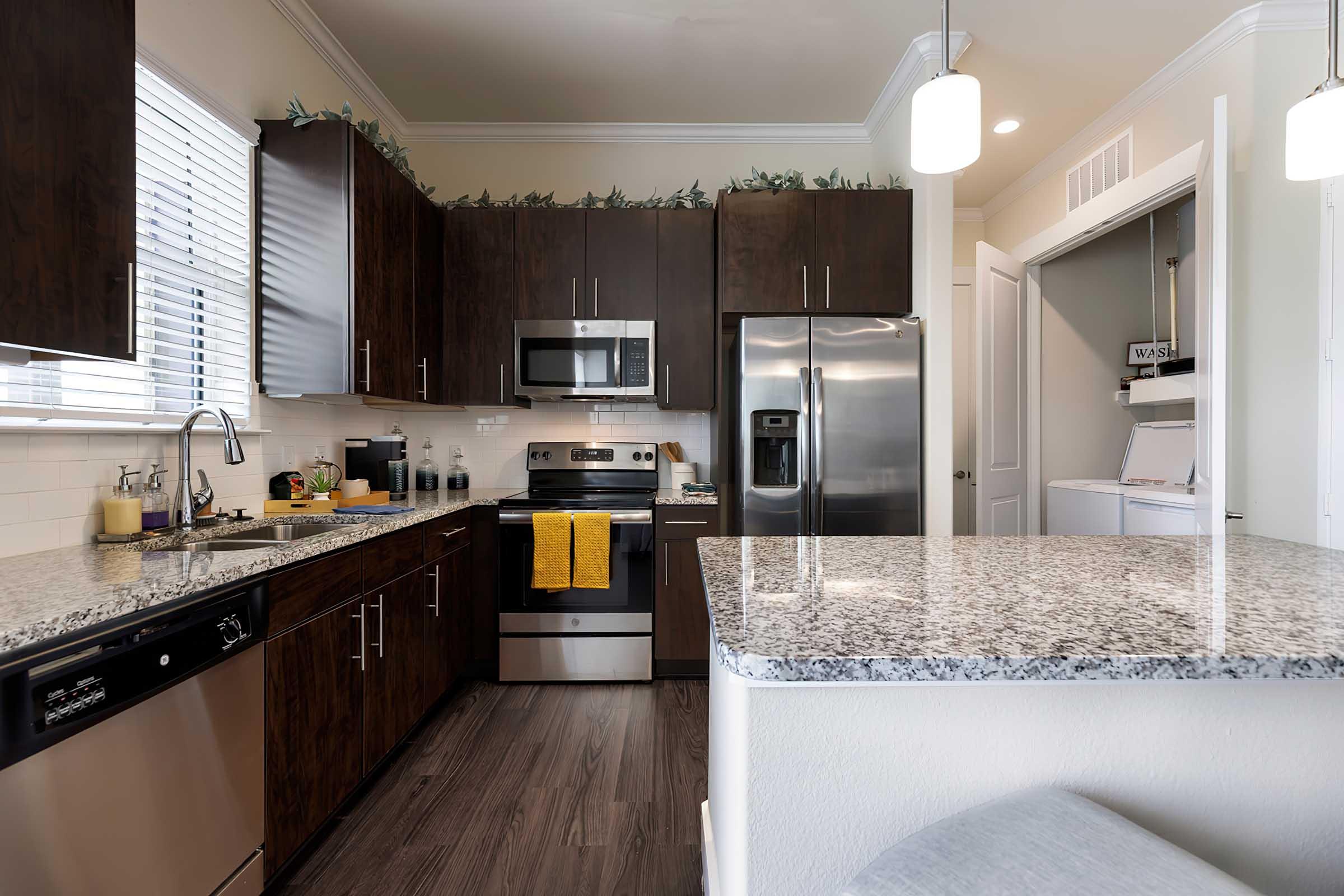 a modern kitchen with stainless steel appliances