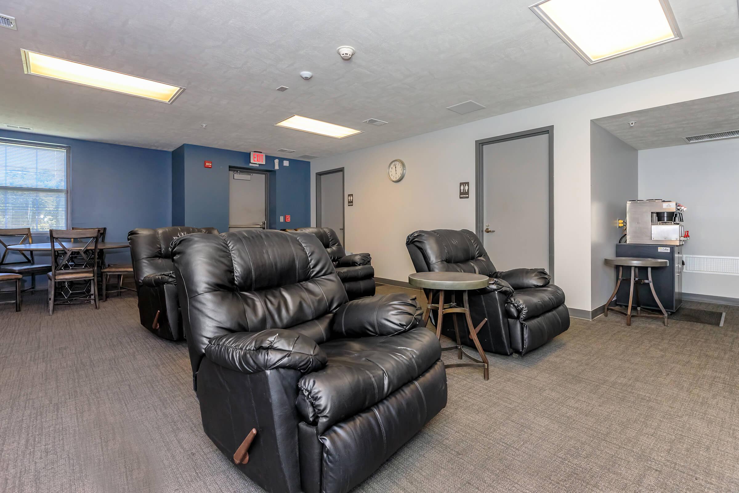 a living room filled with furniture and a tv