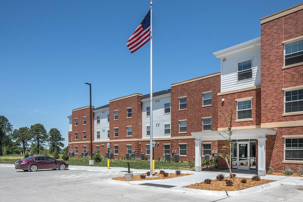 a large brick building with a parking lot