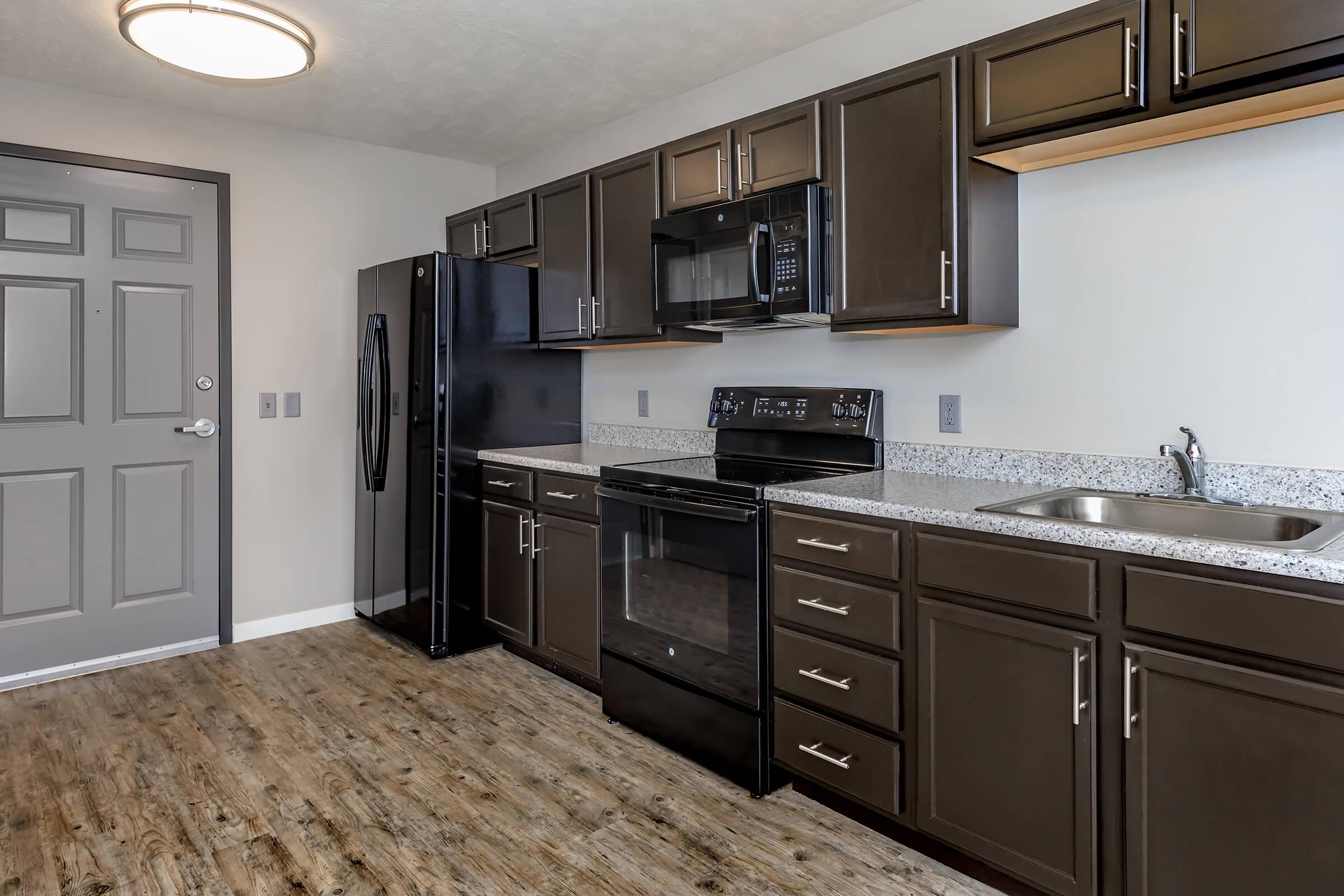 a large kitchen with stainless steel appliances