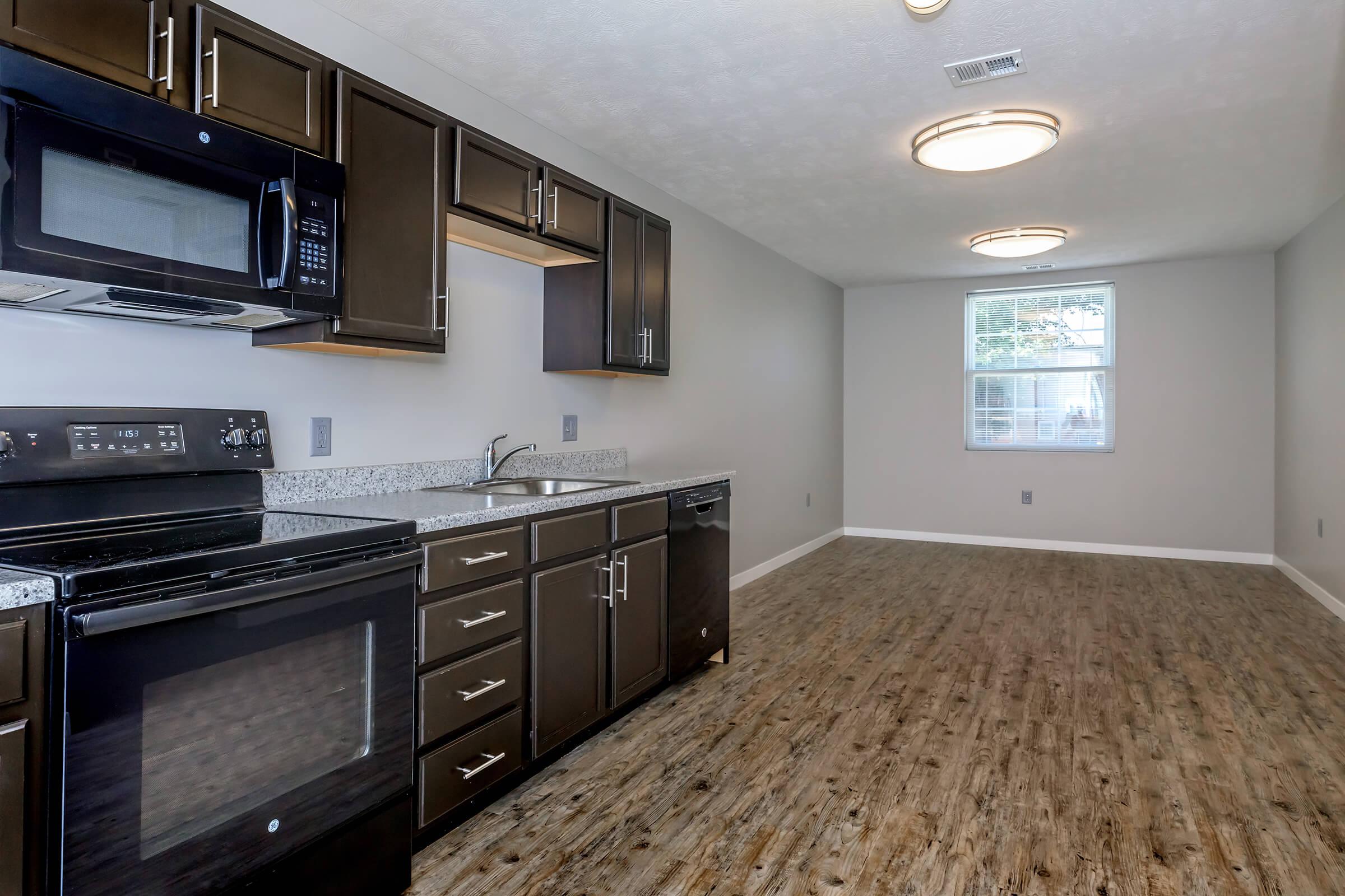 a large kitchen with stainless steel appliances