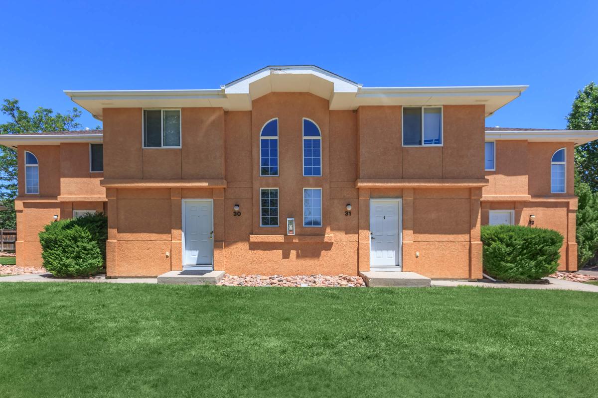 a large lawn in front of a house