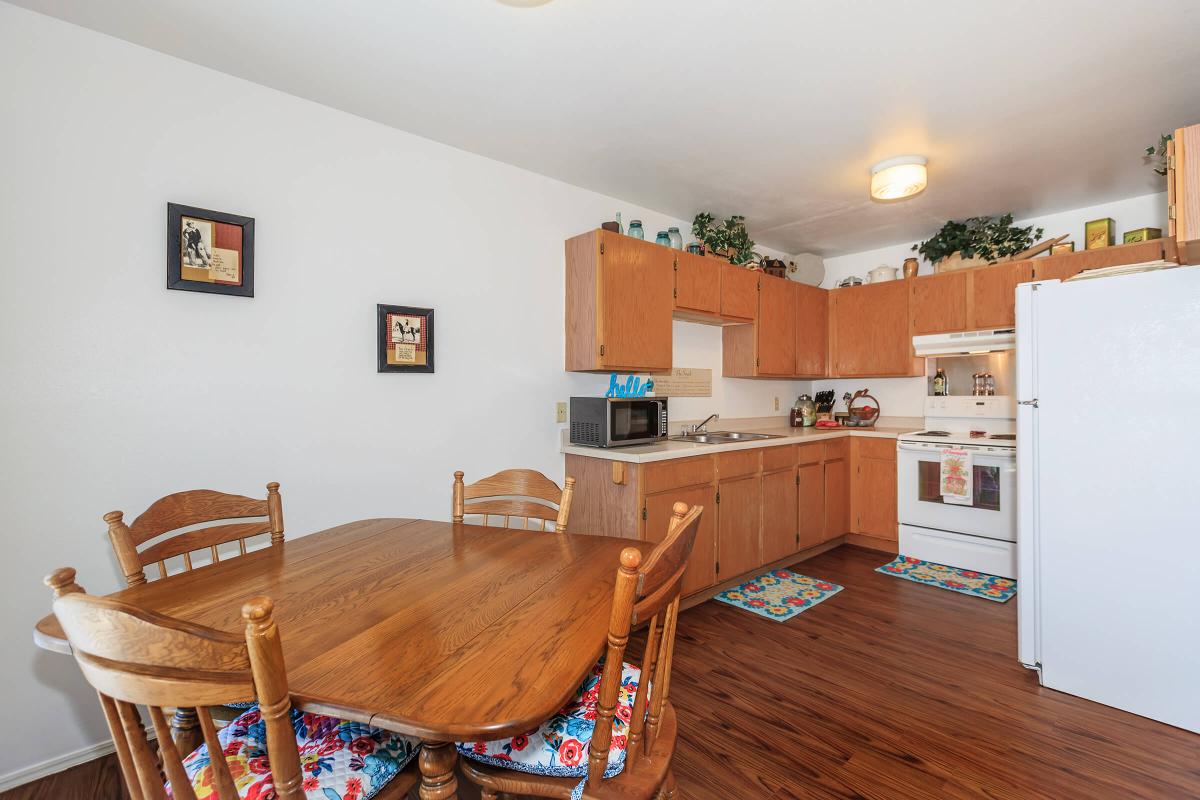 a living room filled with furniture on top of a wooden table