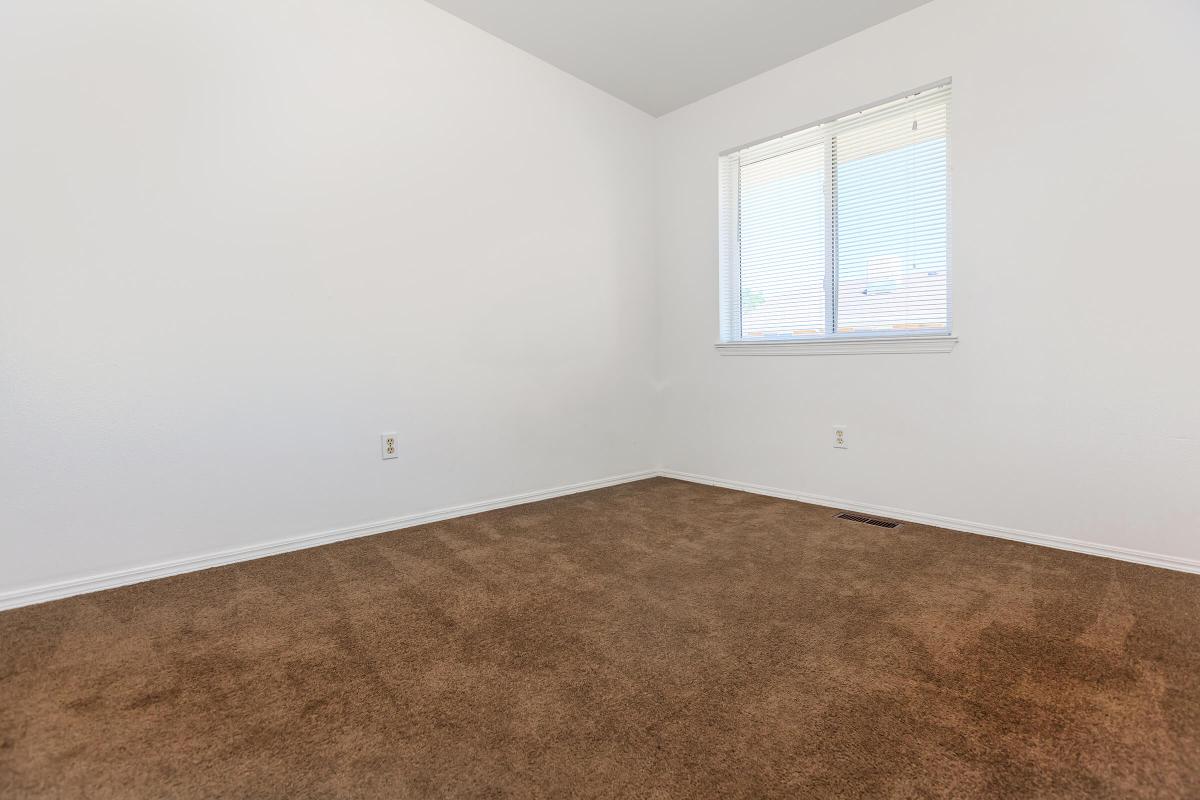 a bedroom with a large window