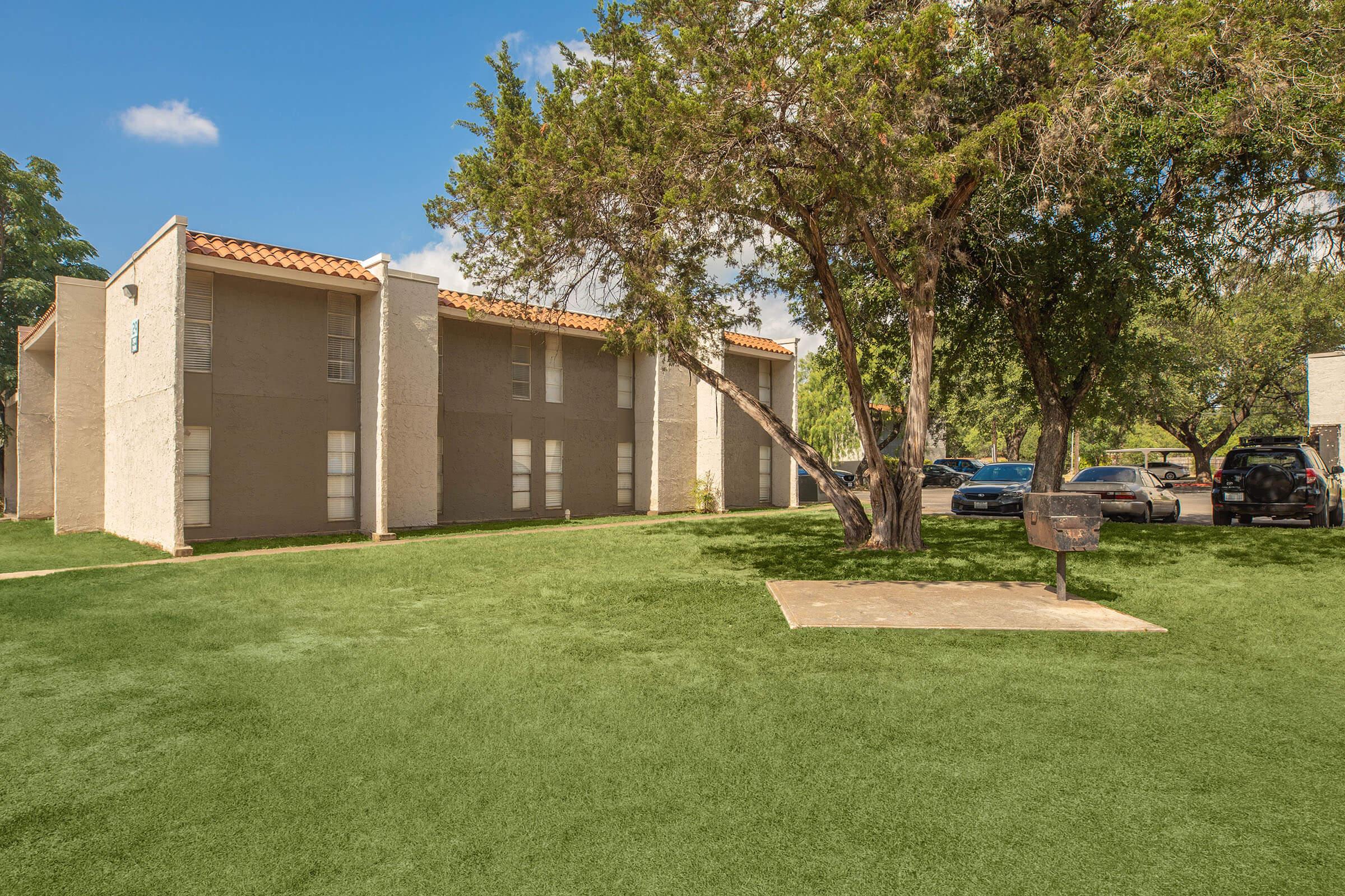 a large lawn in front of a house