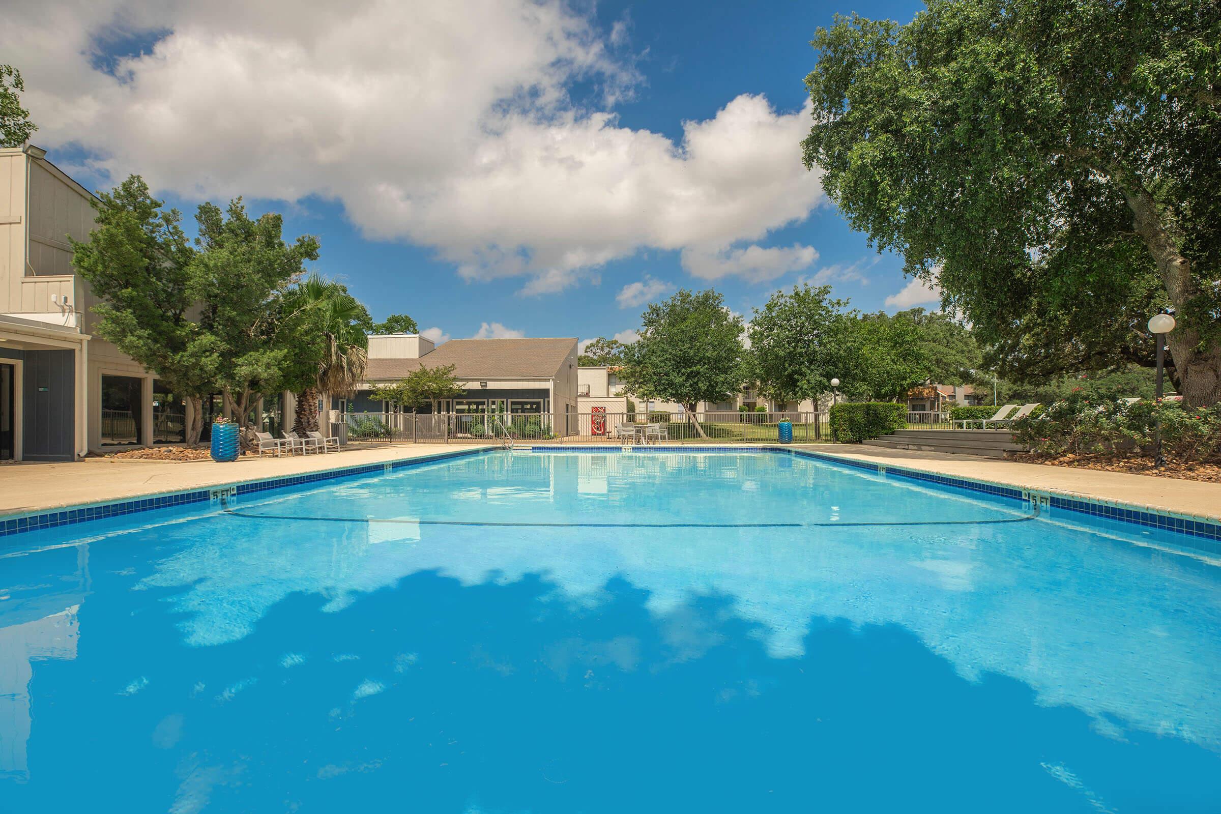 a pool next to a body of water