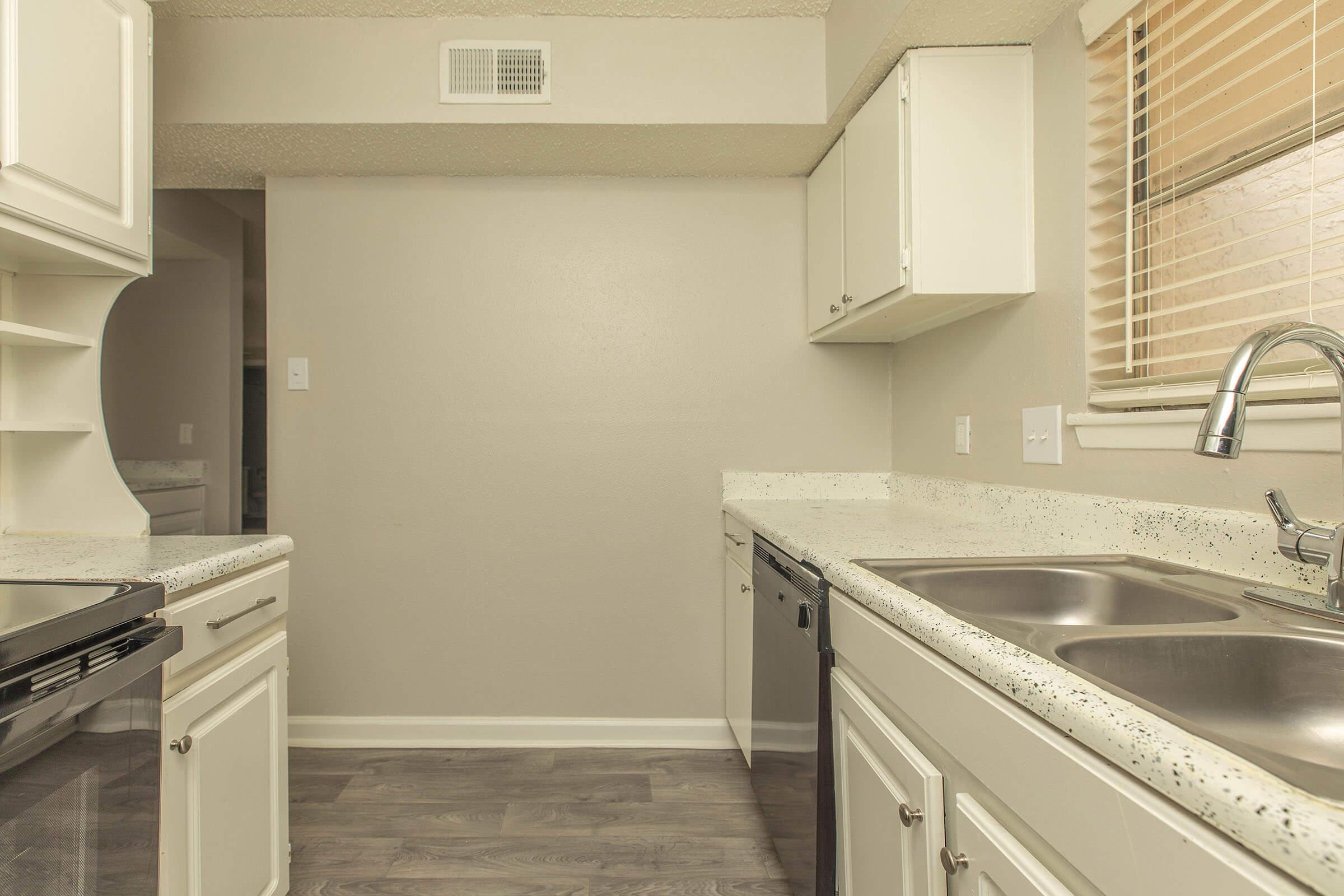 a kitchen with a stove and a sink