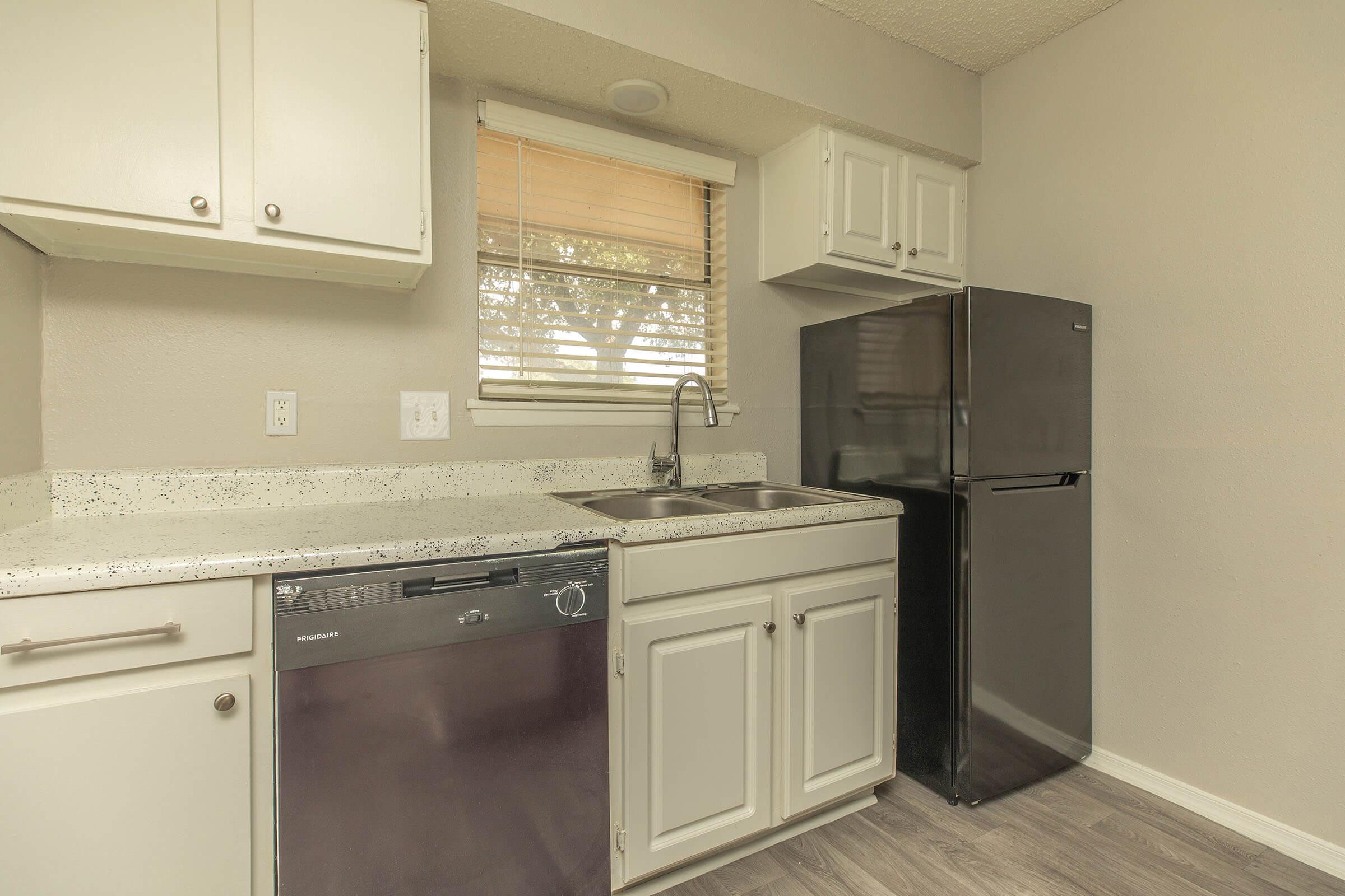 a kitchen with a stove and a refrigerator