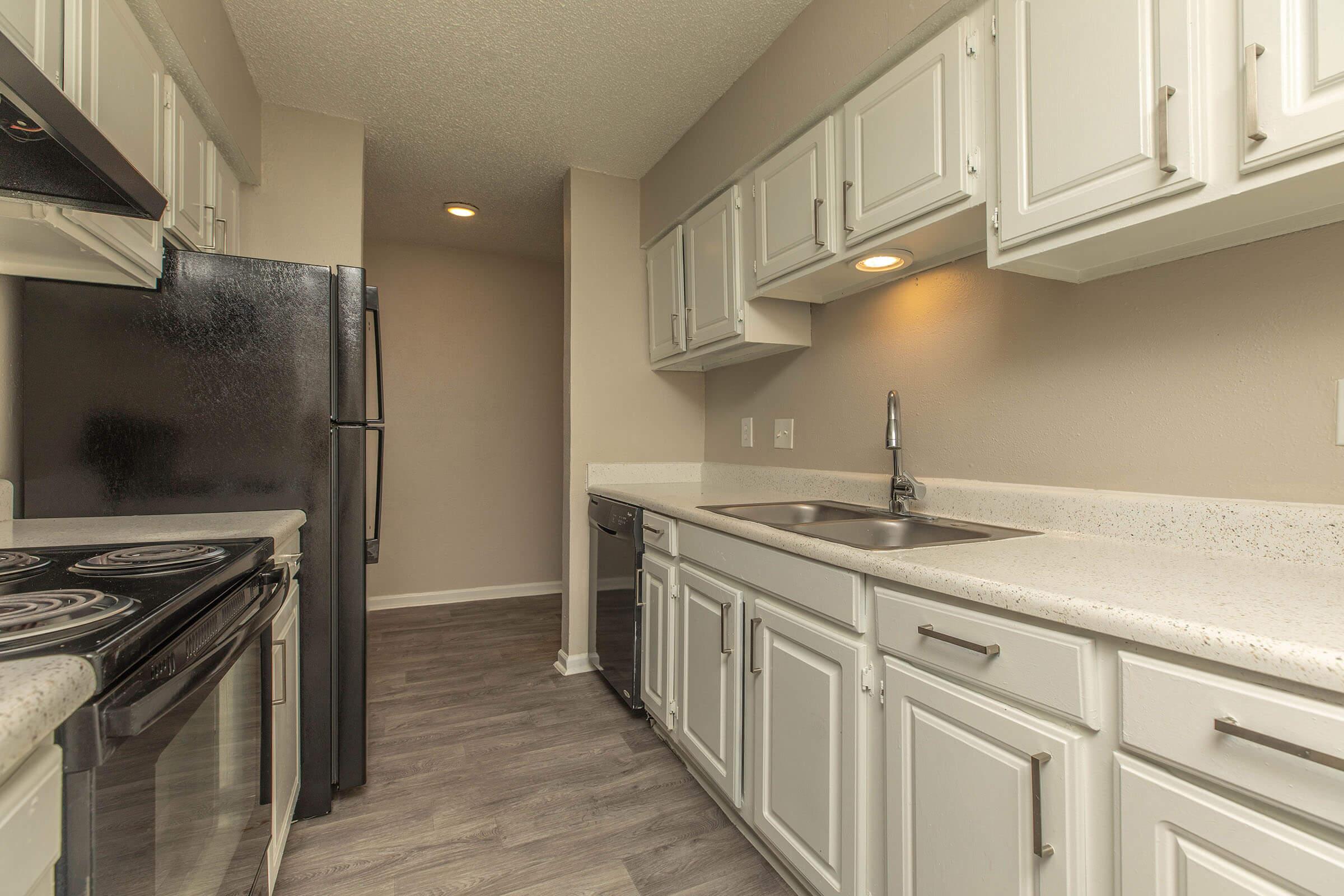 a kitchen with a stove and a sink