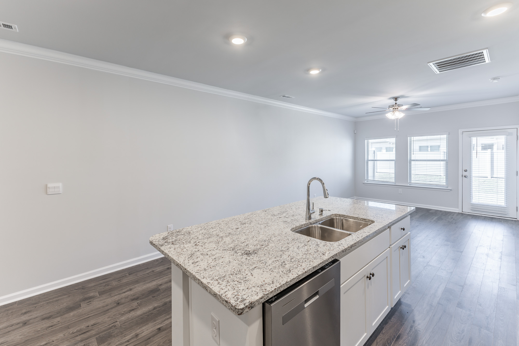 a kitchen with a sink and a mirror