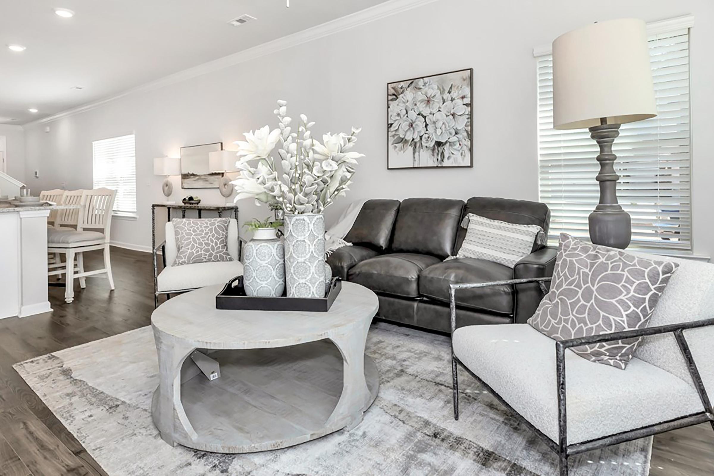 a living room filled with furniture and a fire place