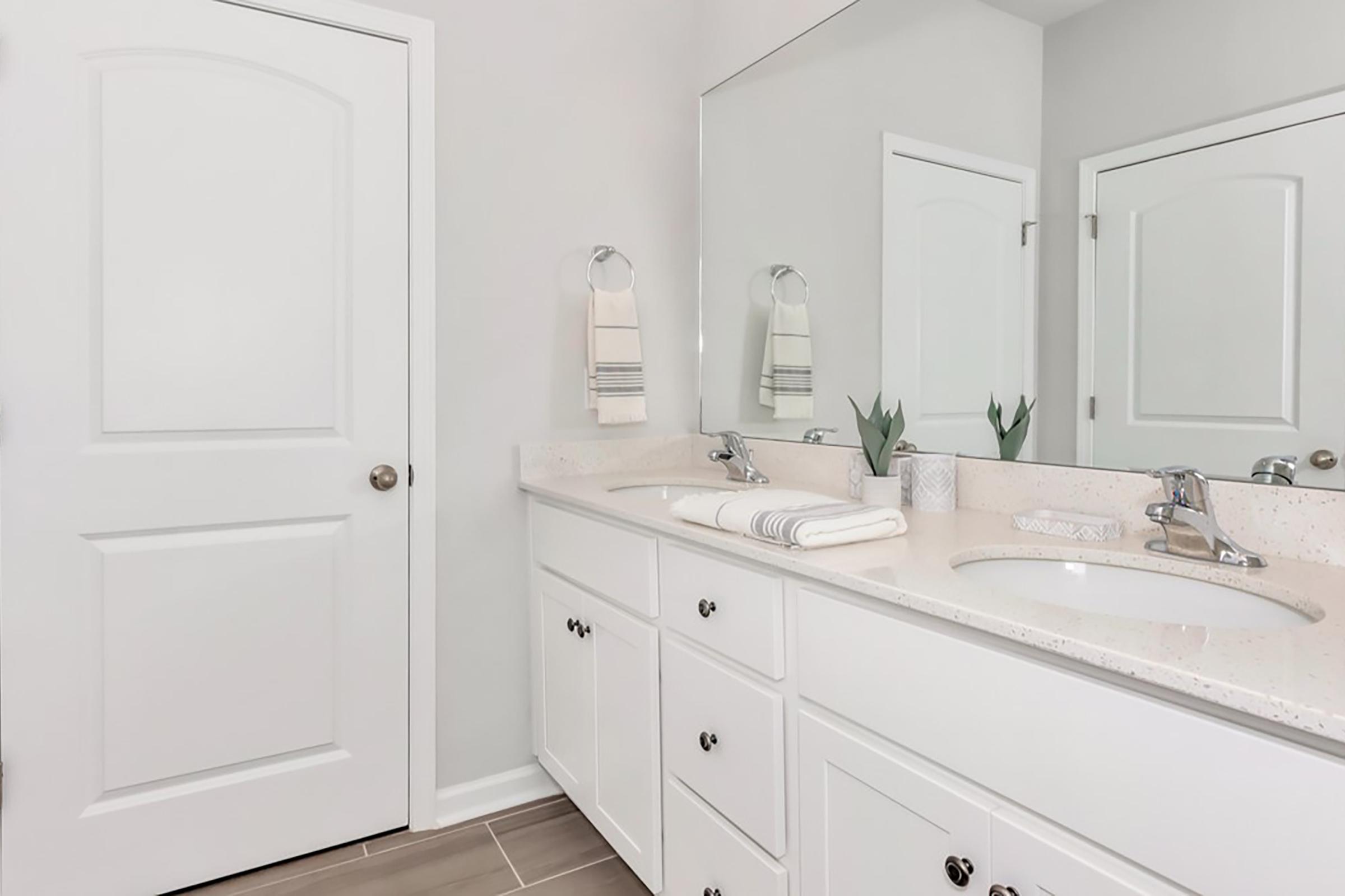 a kitchen with a sink and a mirror