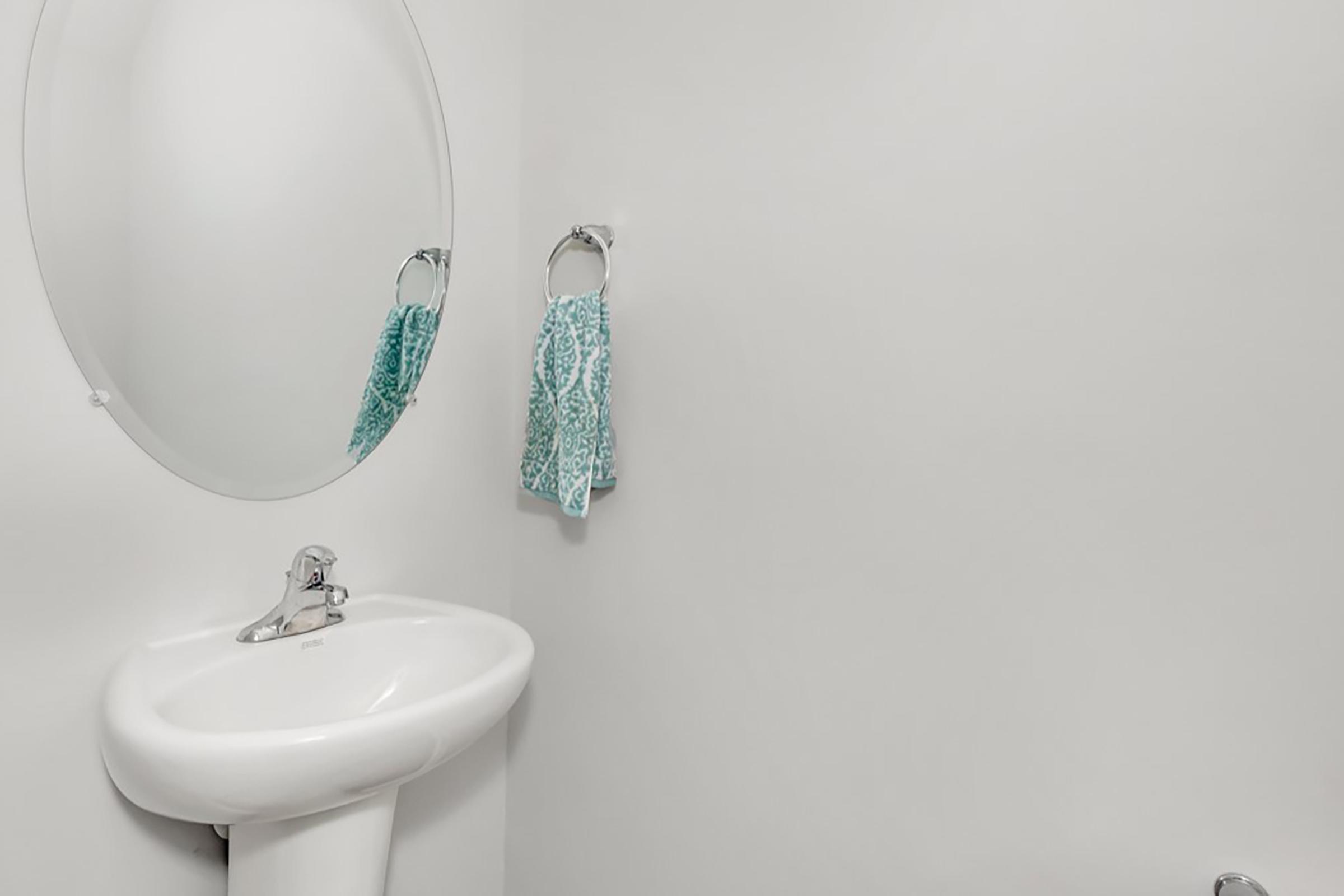 a close up of a sink and a mirror