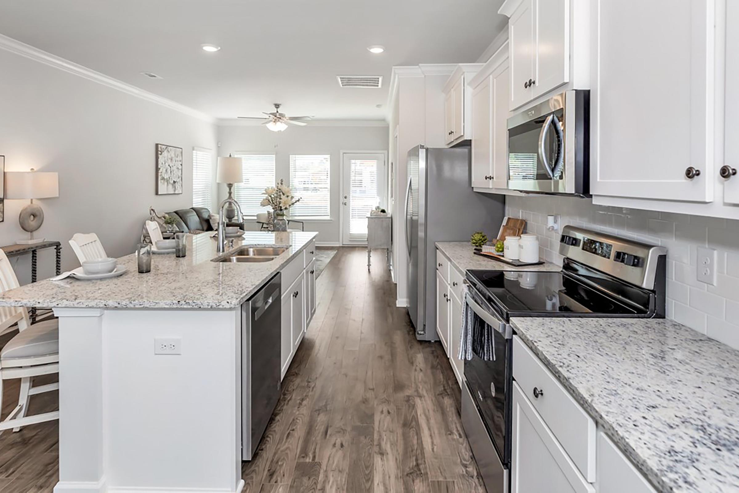 a kitchen with a sink and a microwave