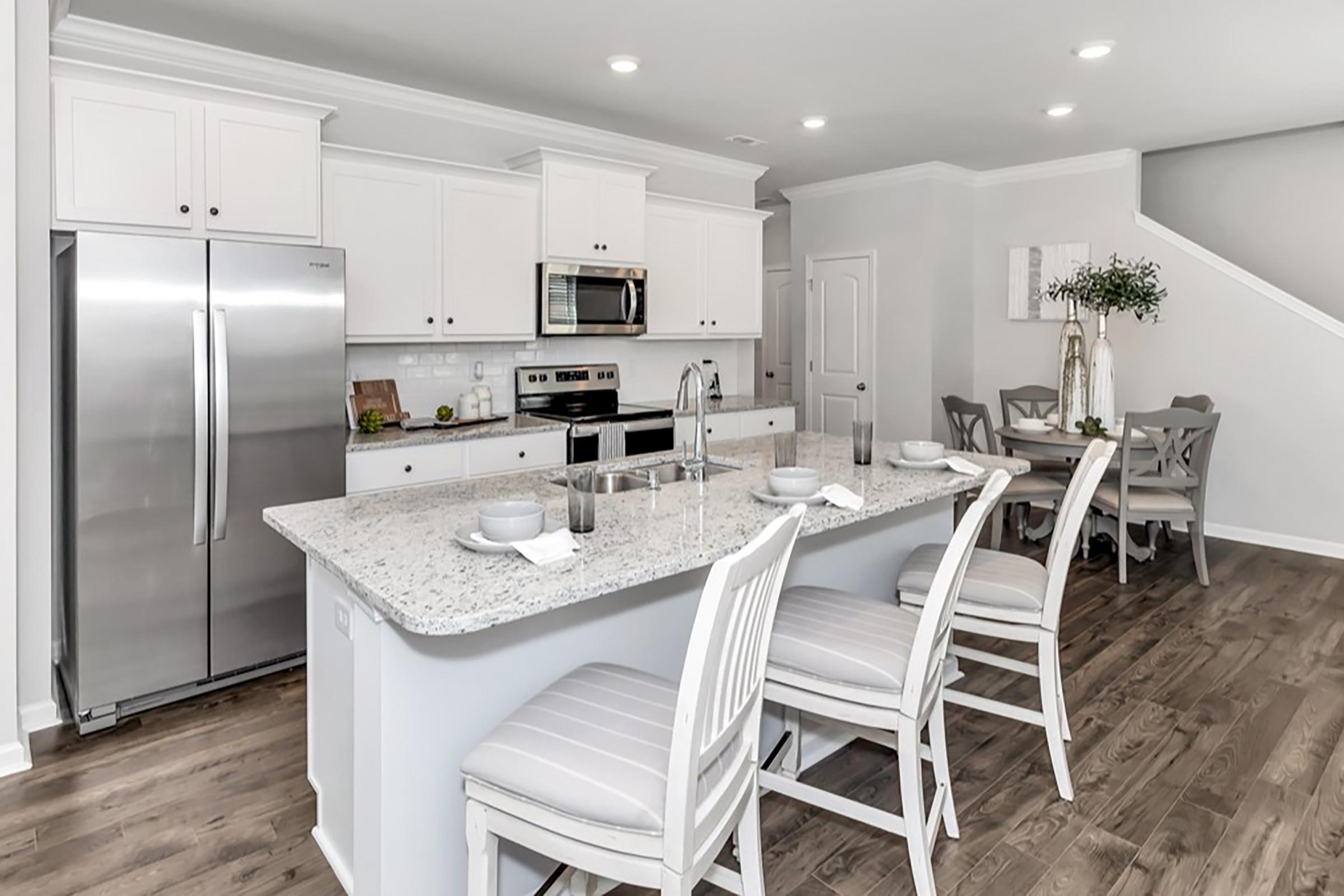 a kitchen with a dining room table