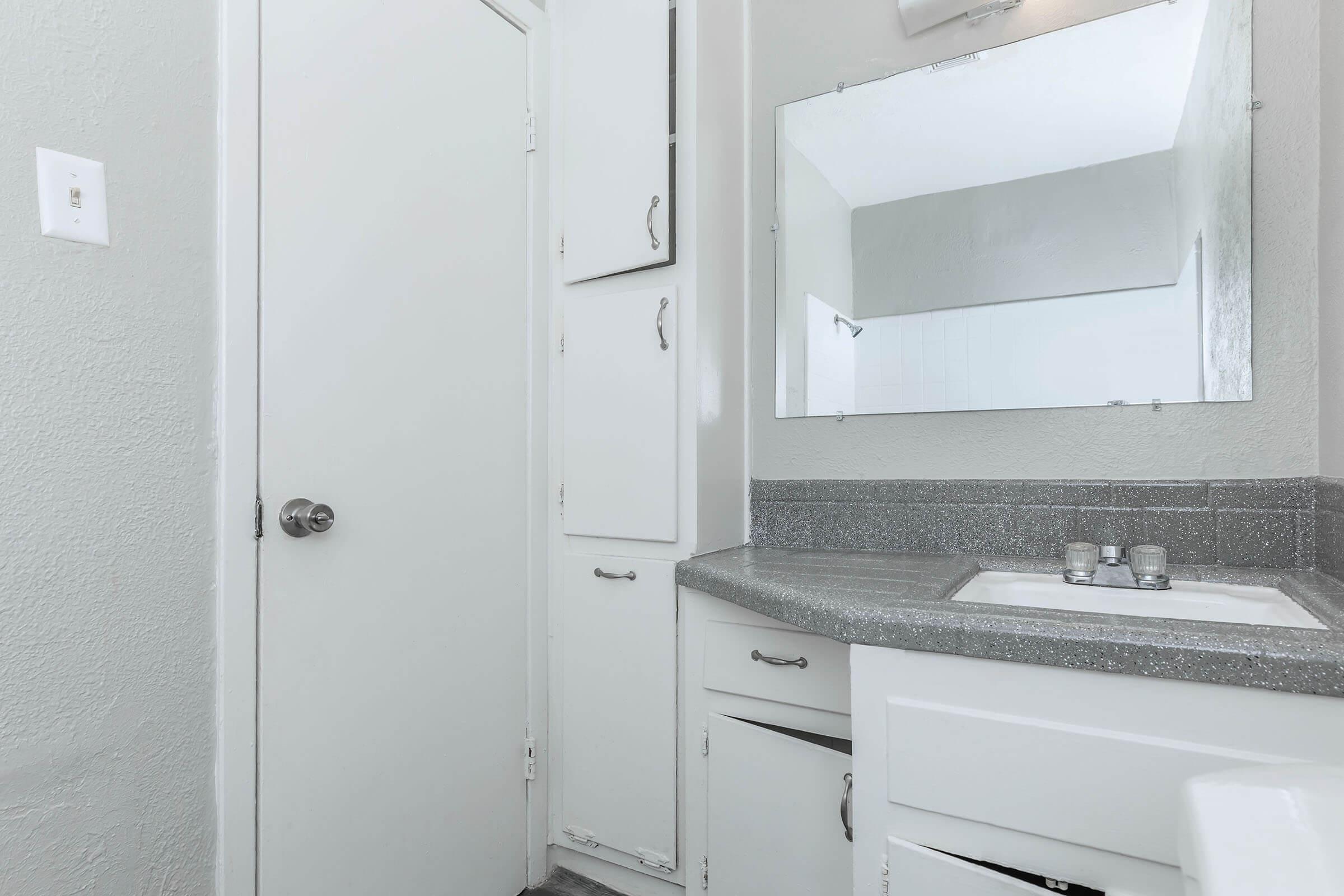 a stove top oven sitting next to a sink