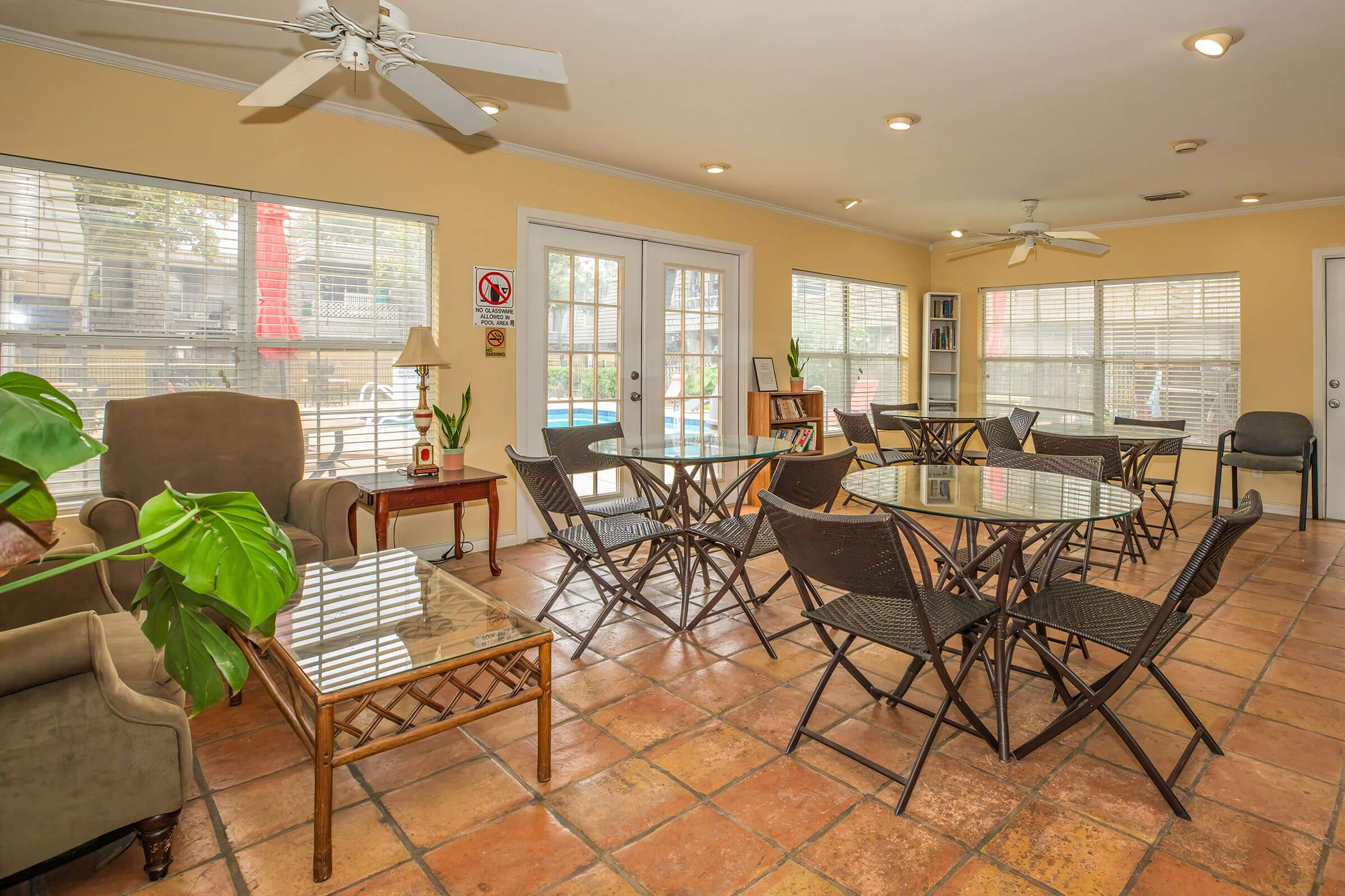 a room filled with furniture and a large window