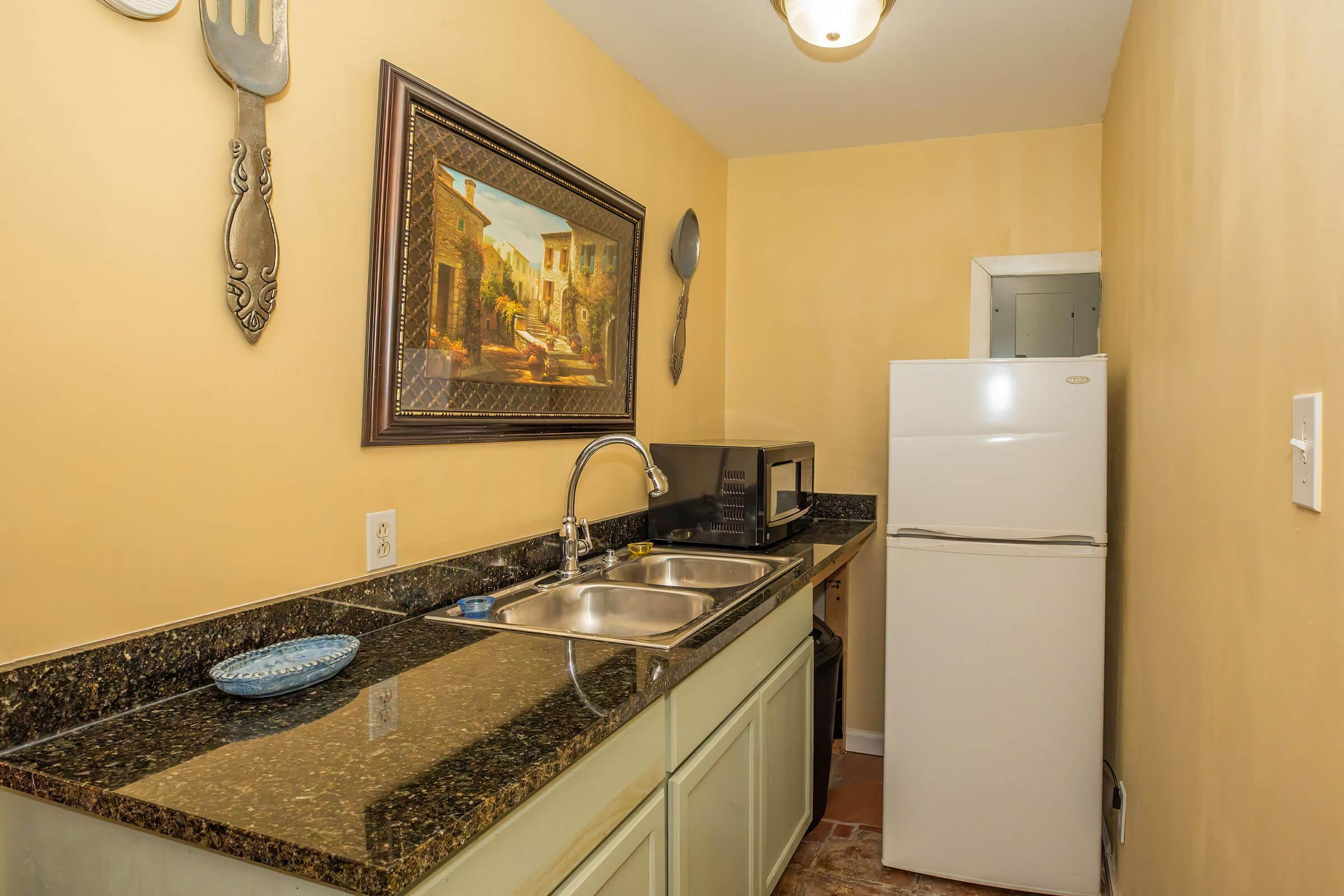 a kitchen with a stove and a sink