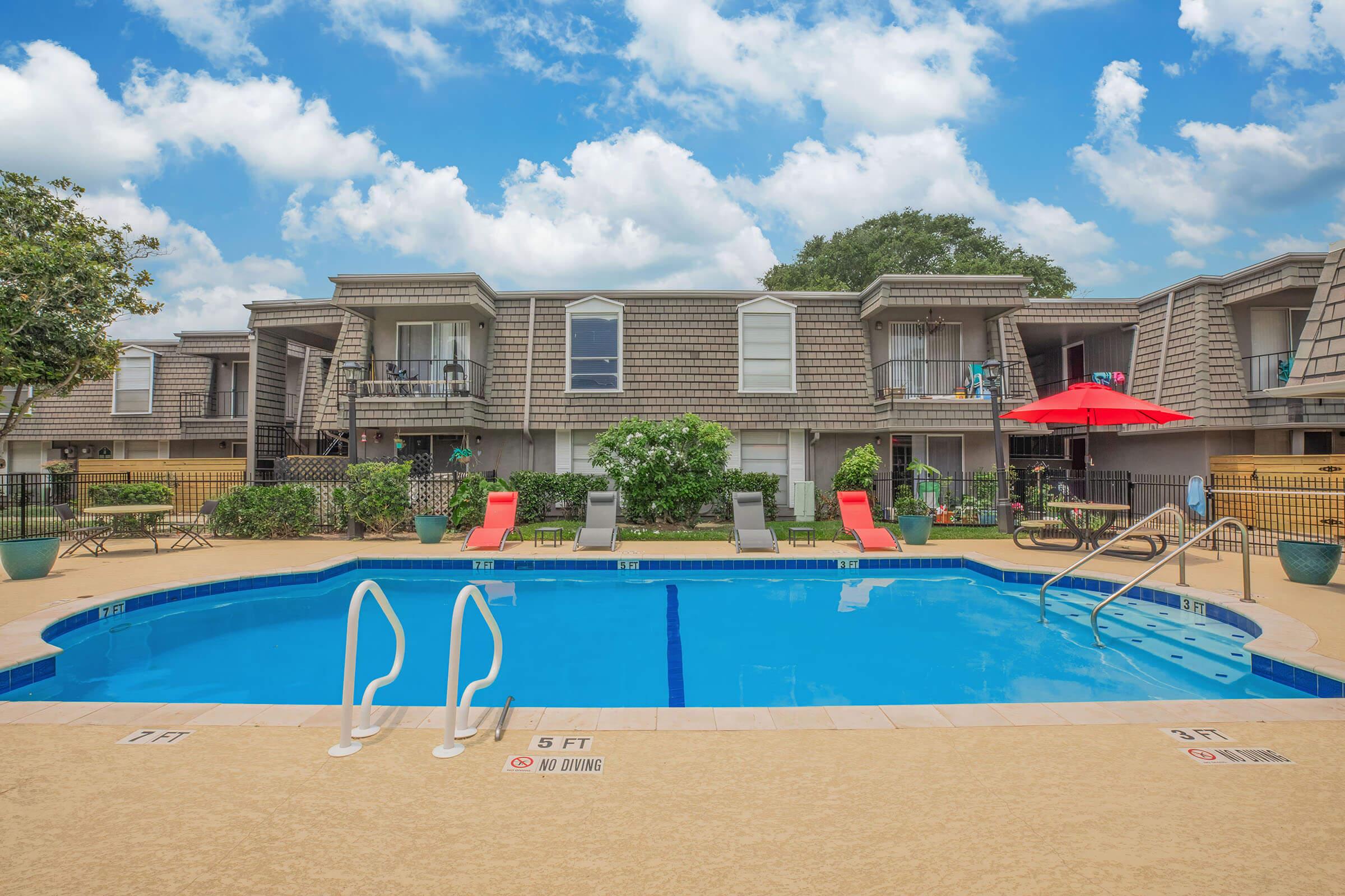 a large pool of water in front of a building