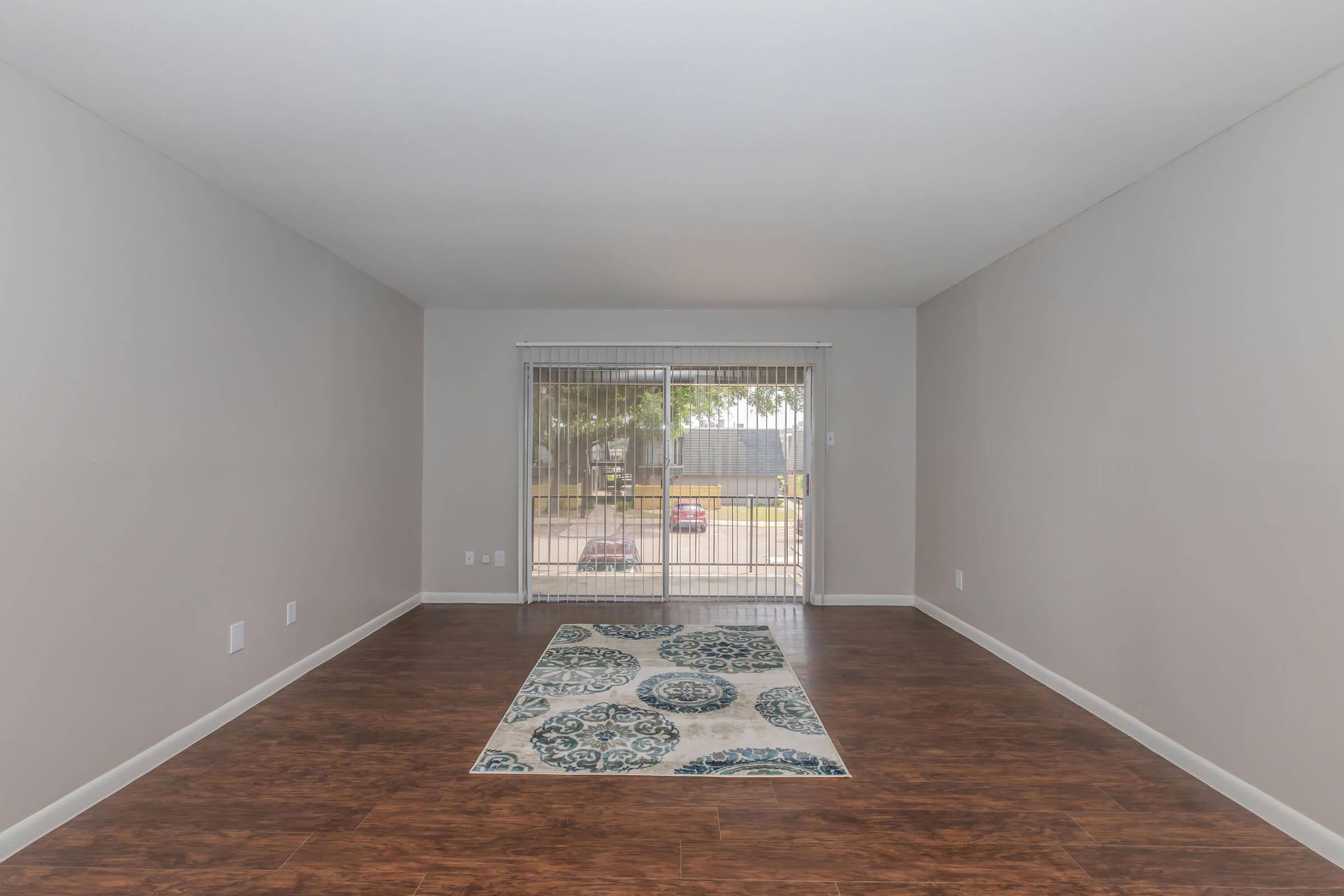 a room filled with furniture and a large window